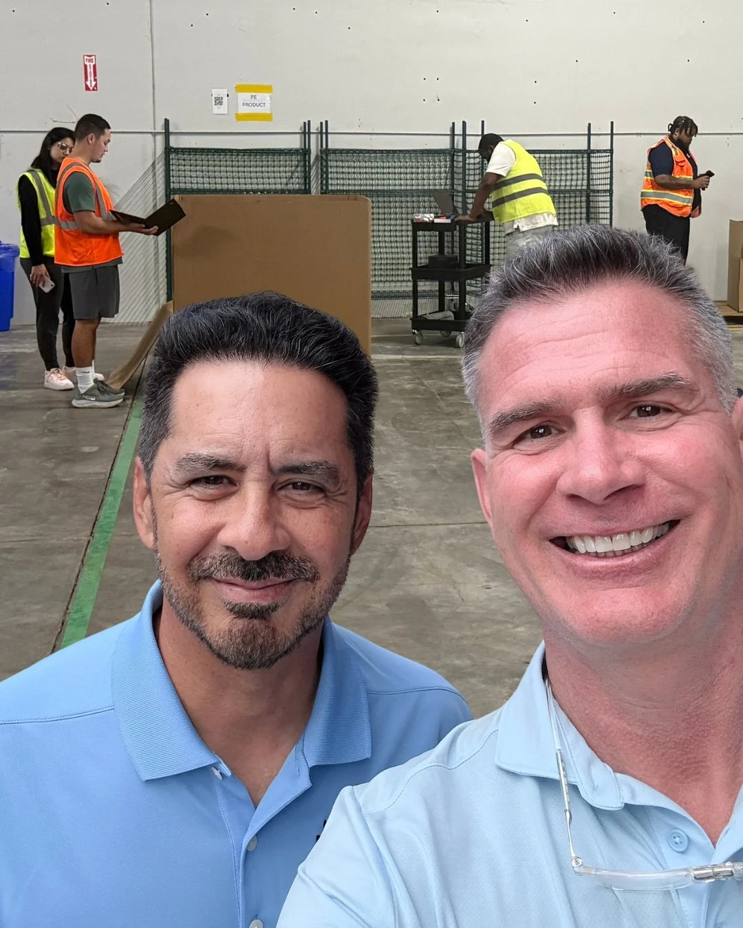 Roman Fitzmartin and Roger Quesada of DNA Logistix at a DNA Logistix warehouse