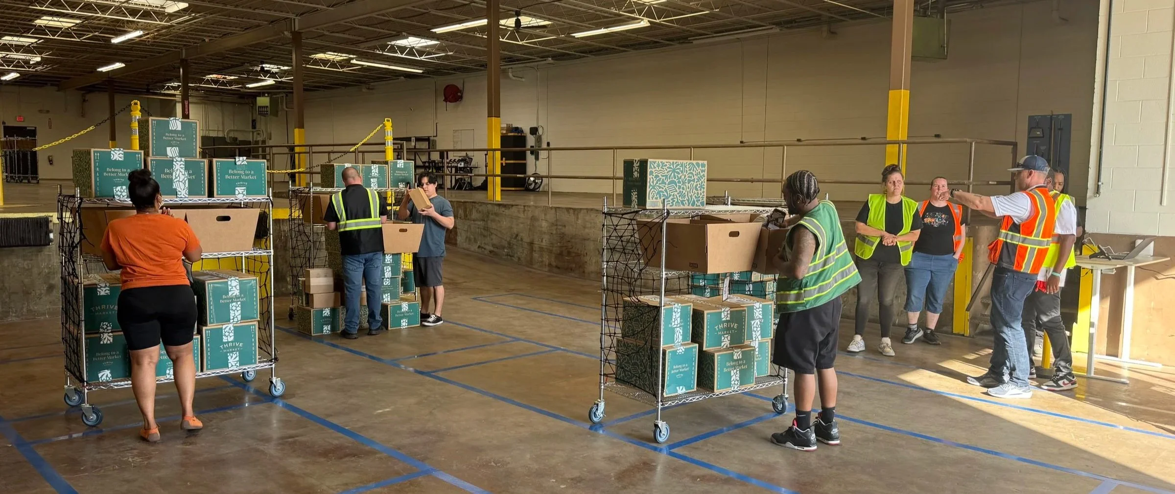 DNA Logistix warehouse team coordinating inventory and order fulfillment operations at a third-party logistics distribution center, supporting nationwide warehousing and supply chain services.