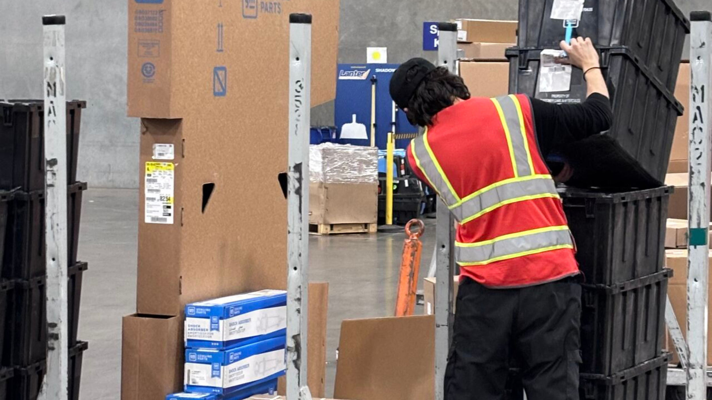 DNA Logistix warehouse associate organizing inventory at a national distribution center, delivering 99.1% inventory accuracy and operational excellence in third-party logistics warehousing.