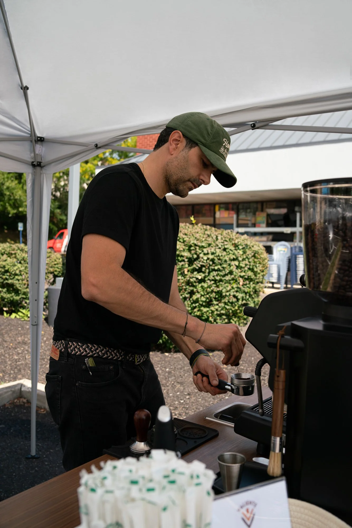 Barista Nicolas preparing a smooth espresso shot at a corporate brand activation event.