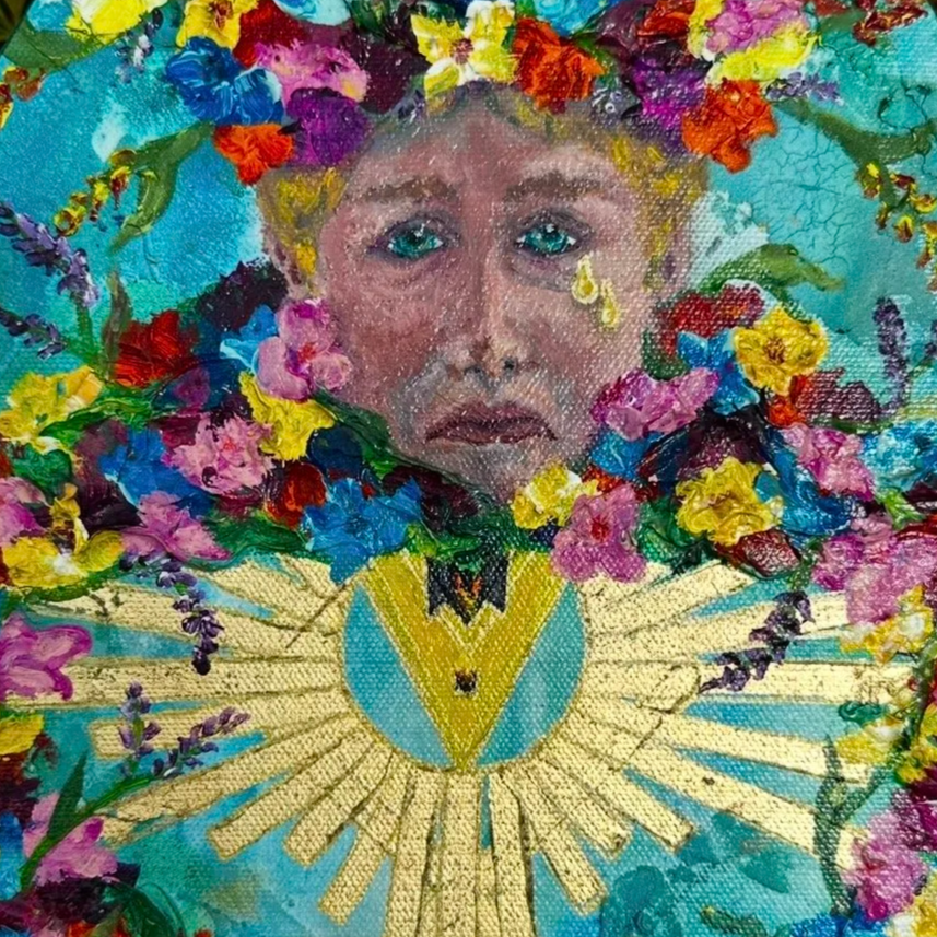 A colorful, artistic portrait of a young girl with blue eyes, surrounded by vibrant flowers and greenery, reminiscent of a floral or fantasy-themed artwork.