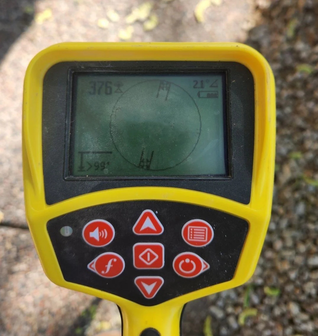 "Mountain Vista Plumbing technician using locator wand to find underground utility line in Tempe, AZ"