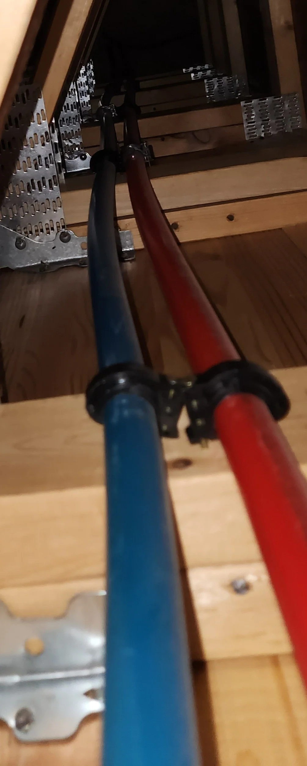 "PEX pipe run through interior wall during home repiping in Mesa, AZ — Mountain Vista Plumbing"