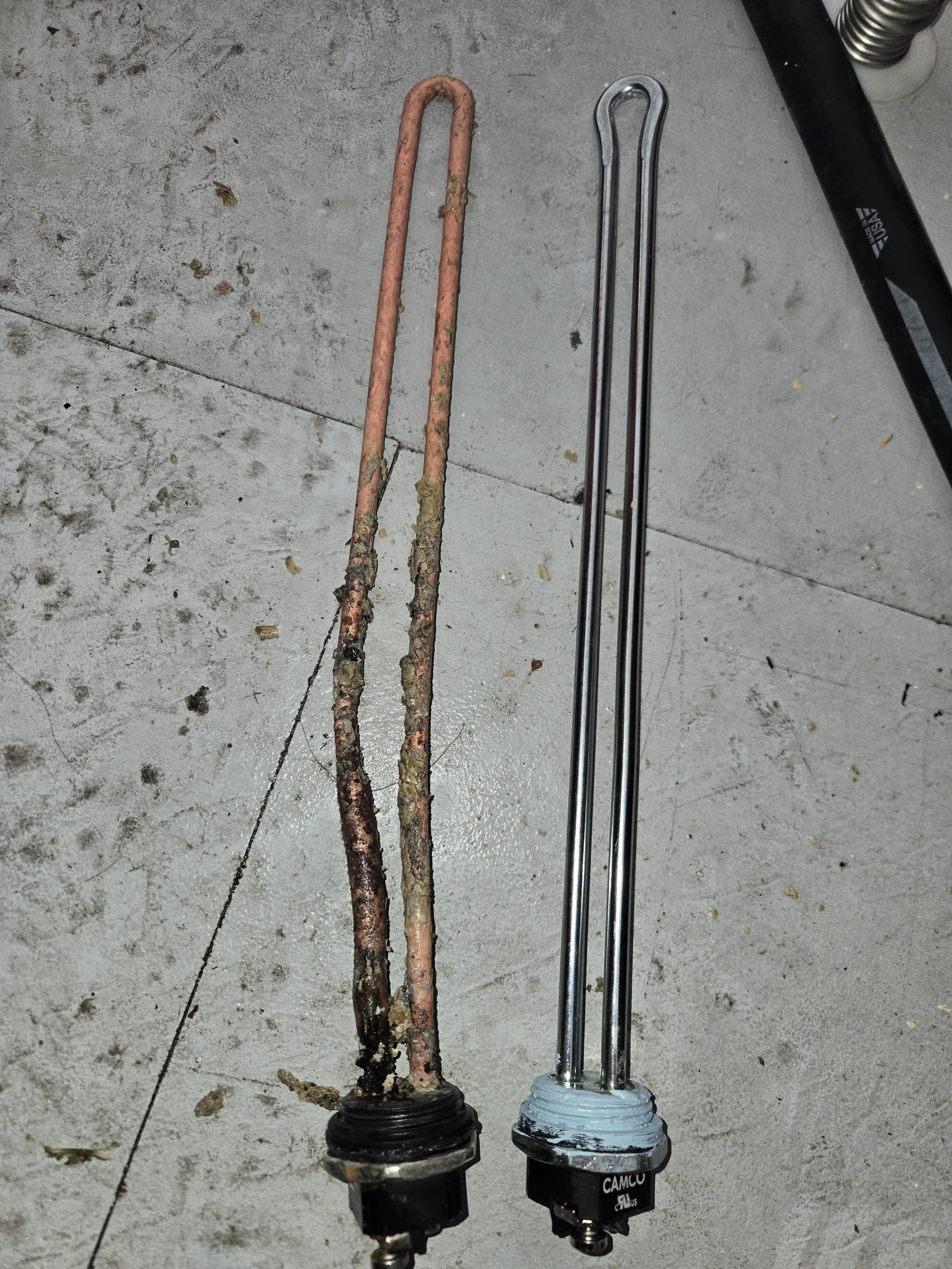 Old vs new Electric water heater element to fix a  no hot water call in Apache Junction, AZ