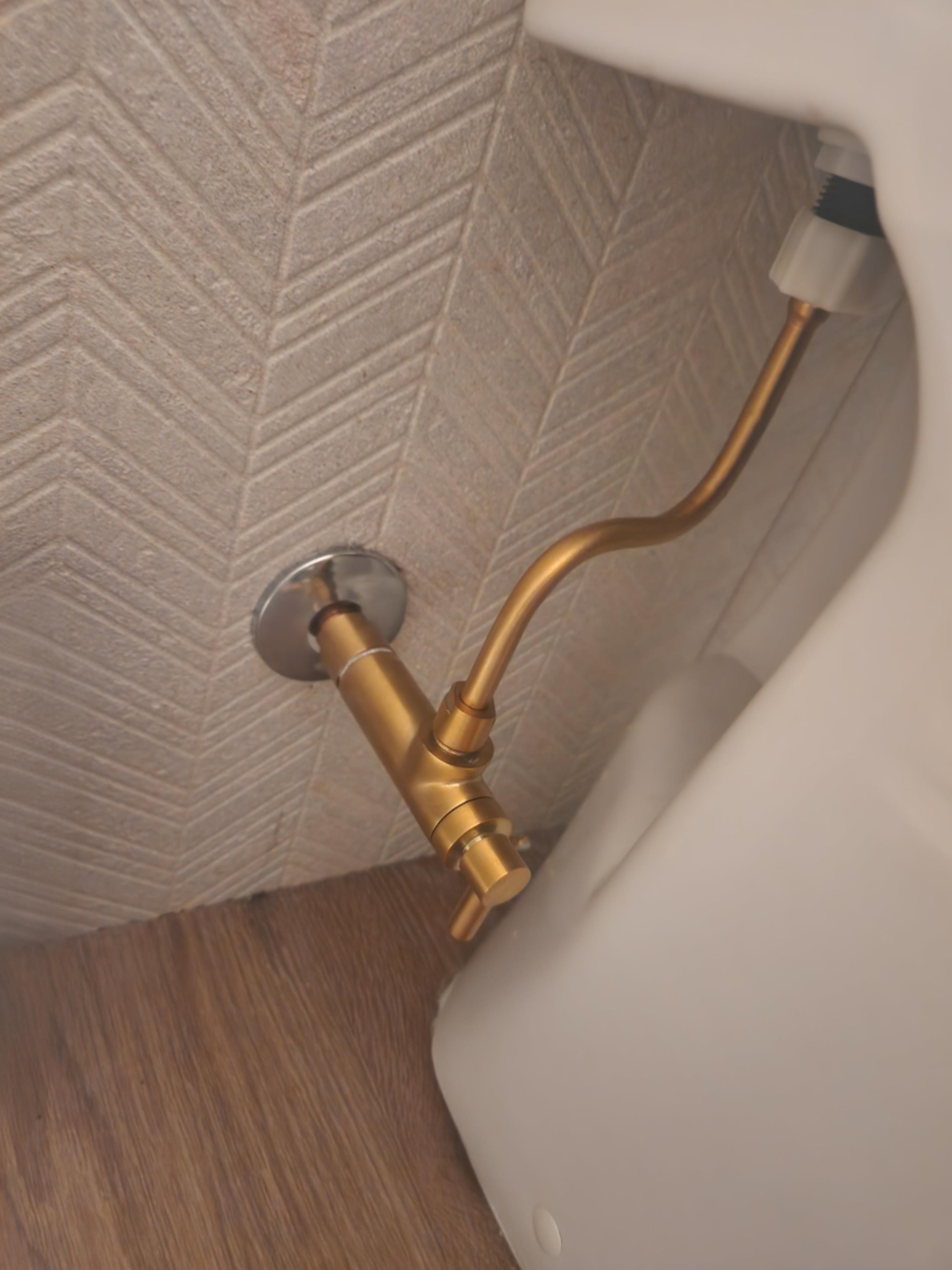 A beautiful golden angle stop with rigid supply tube we installed in Scottsdale, AZ.