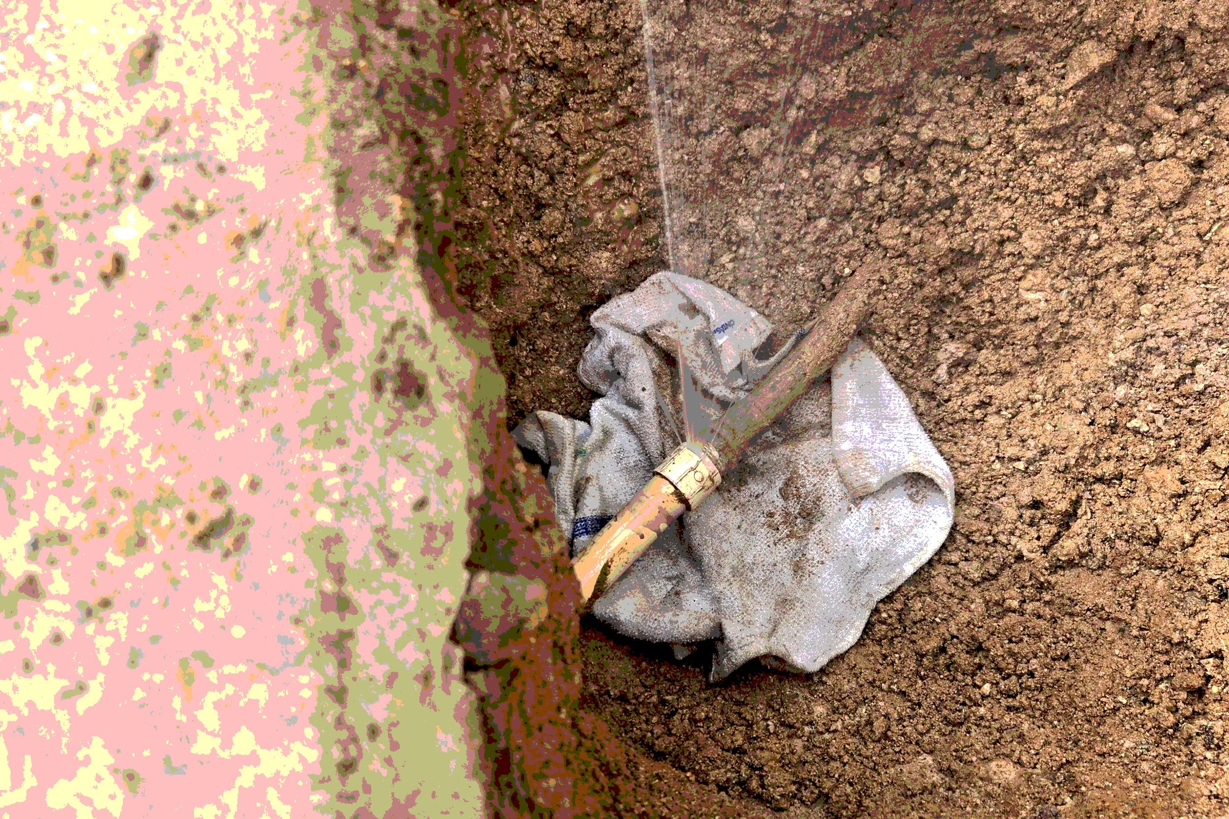 "Burst water main spraying water at Glendale, AZ home — Mountain Vista Plumbing emergency repair"