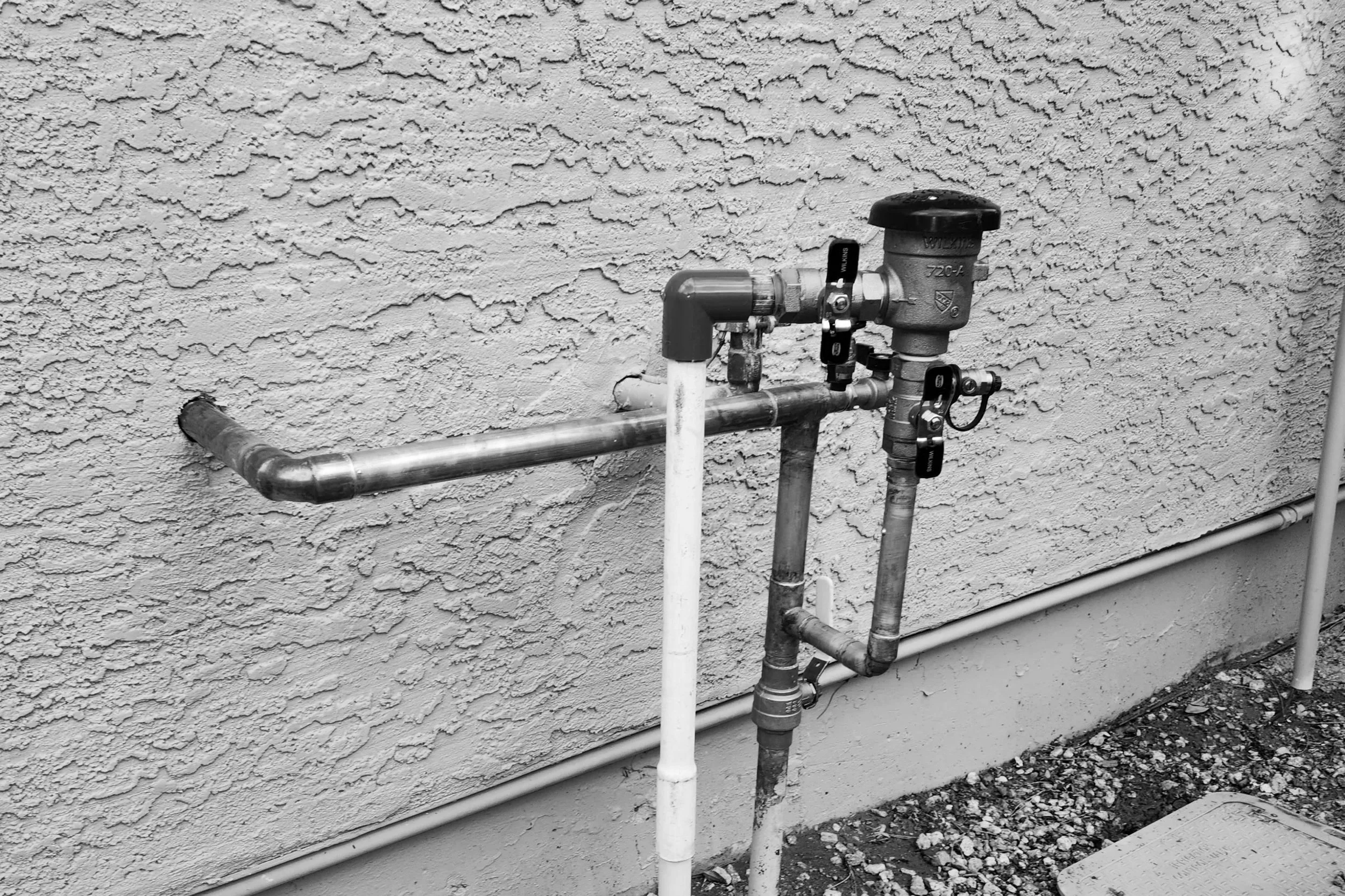 "Water service assembly with ball valve, hose bib, and pressure vacuum breaker installed in Mesa, AZ — Mountain Vista Plumbing"