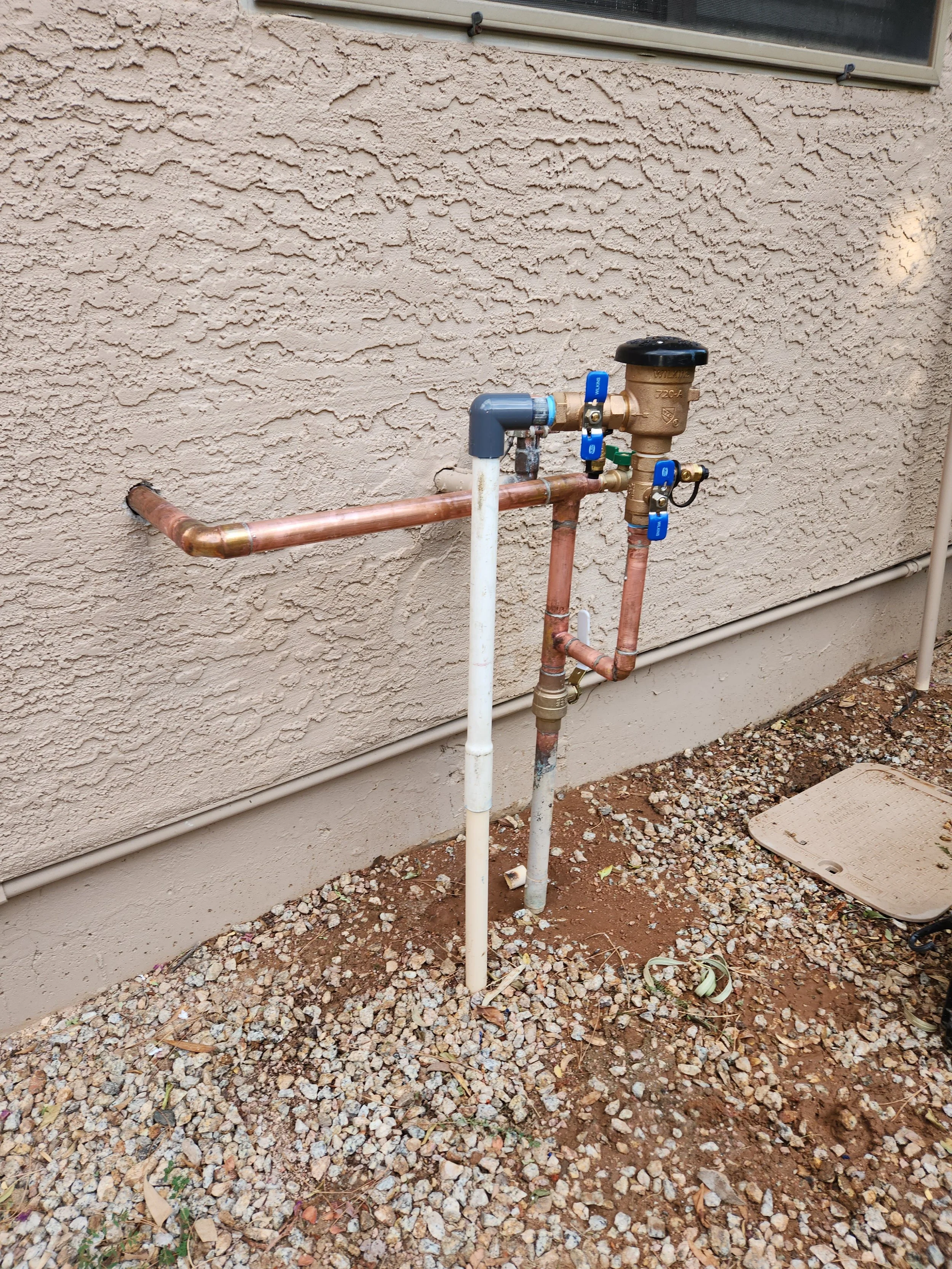 A new water service with a new shut off valve, pressure vacuum breaker, and hose bib in Mesa, AZ