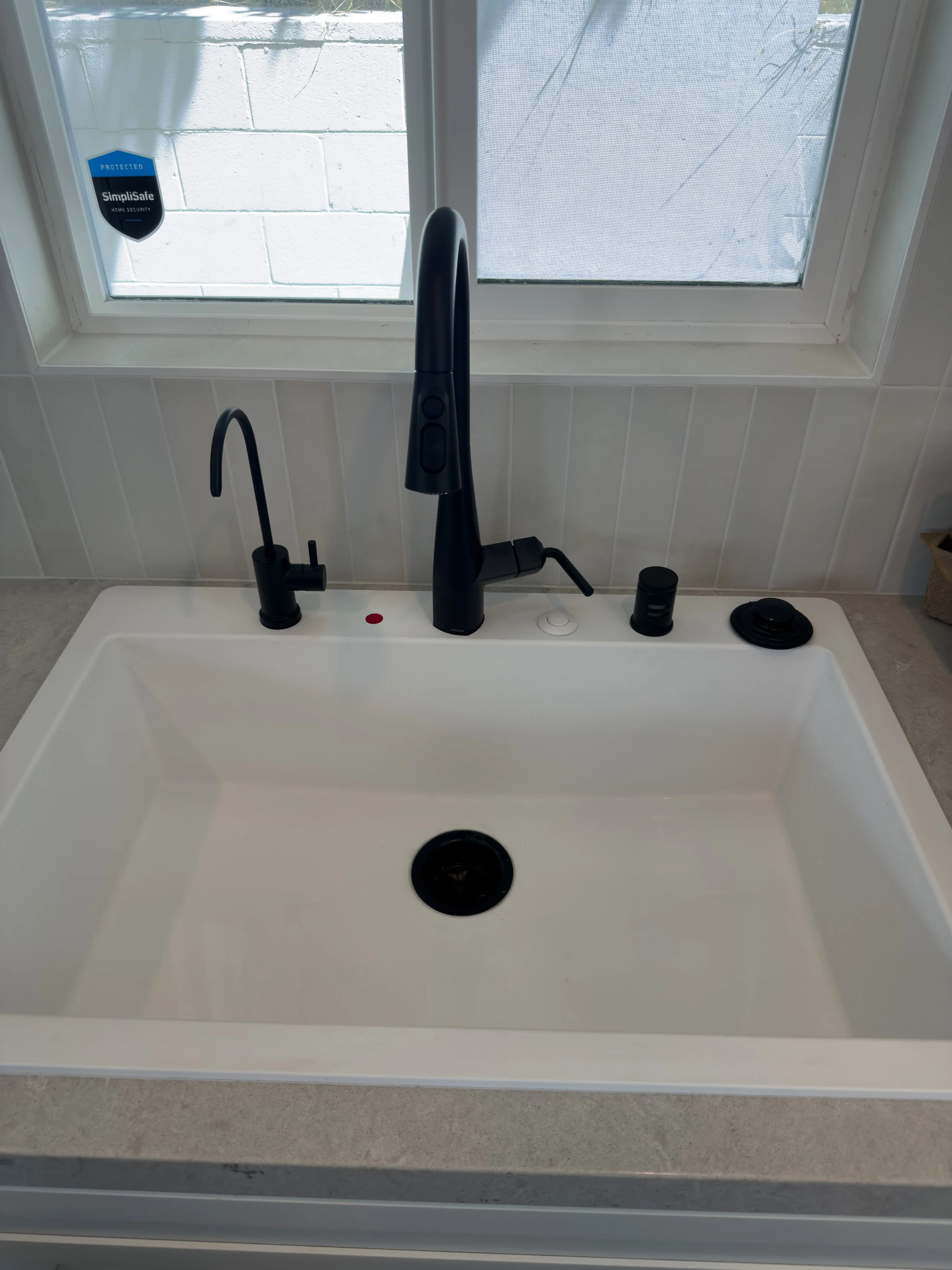 Sink, kitchen faucet, RO spout, and garbage disposal button installed in Pasadena, CA.