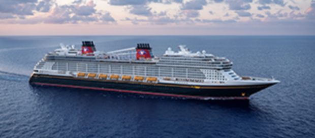 Cruise ship sailing in open ocean under a partly cloudy sky.