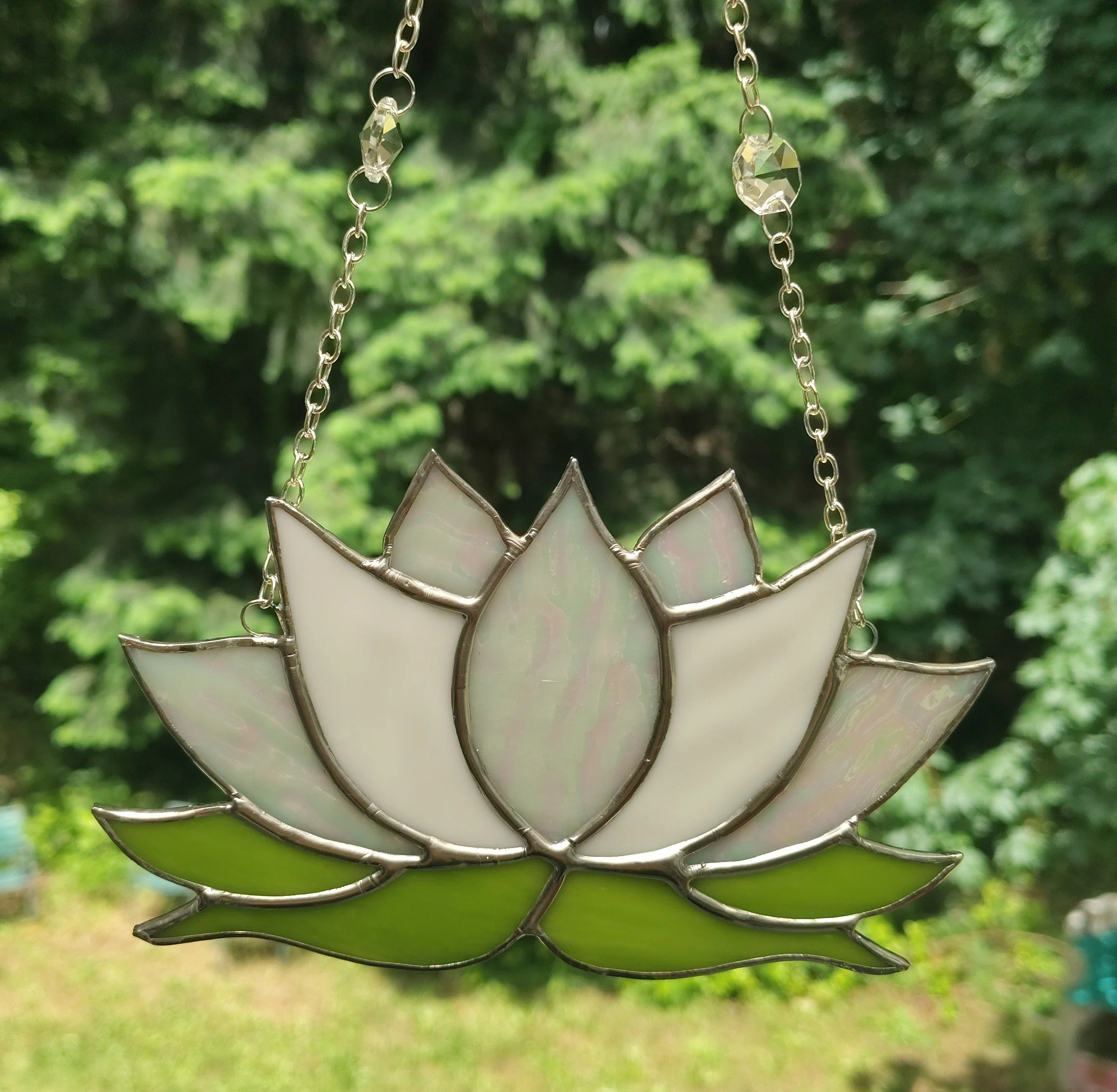 white lotus with green leaves made of stained glass