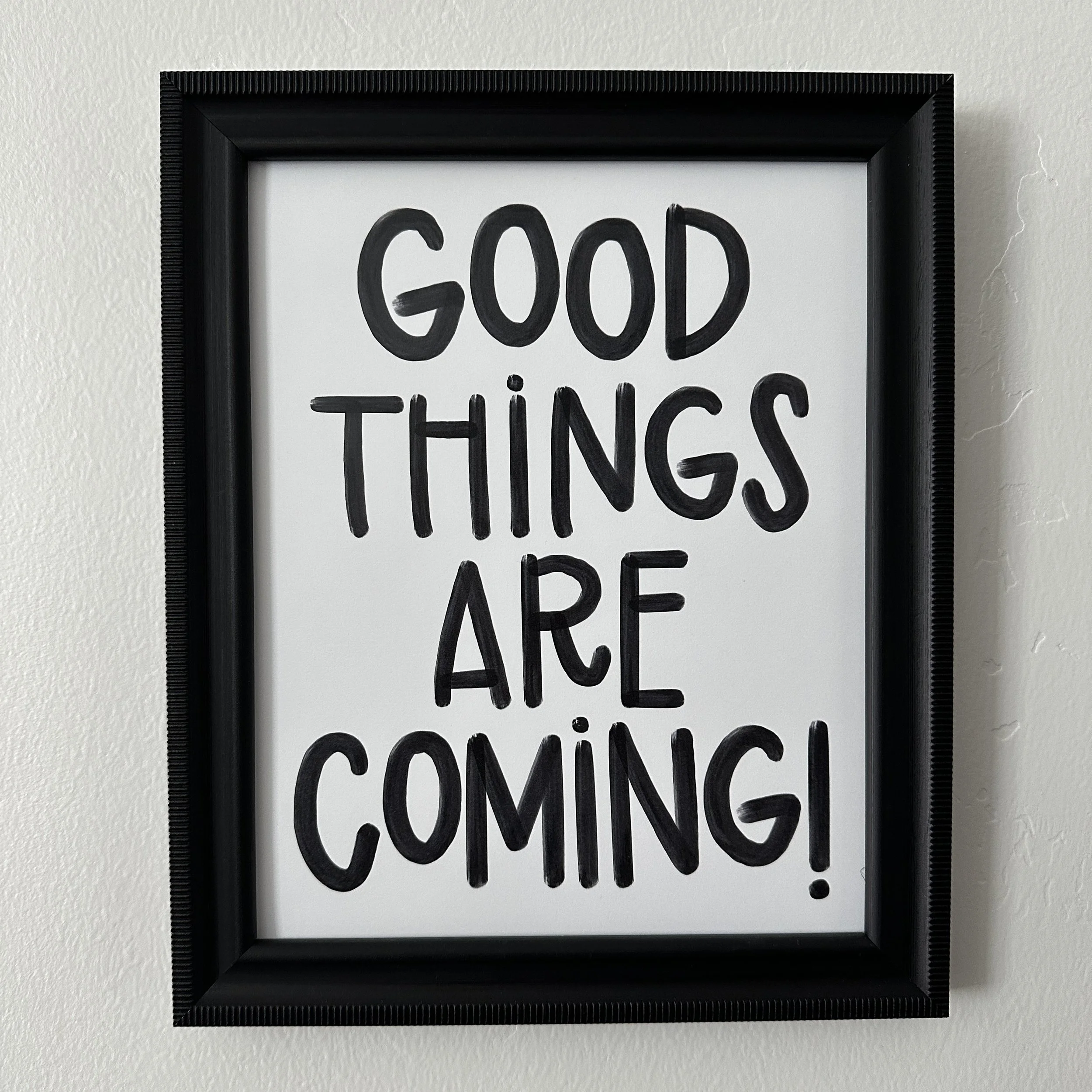 Framed digital print with handwritten text 'GOOD THINGS ARE GOOD' in black marker.