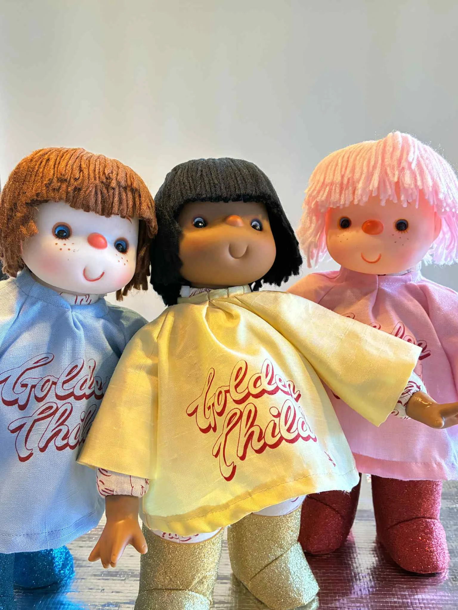 "Golden Child Doll"  2025
Silk Screen Print on linen cotton, vintage fabrics and 250gsm paper, Deadstock plastic and acrylic wool doll heads and hands, Glitter felt.
36 cm
Edition of 12
Each doll is unique and named.