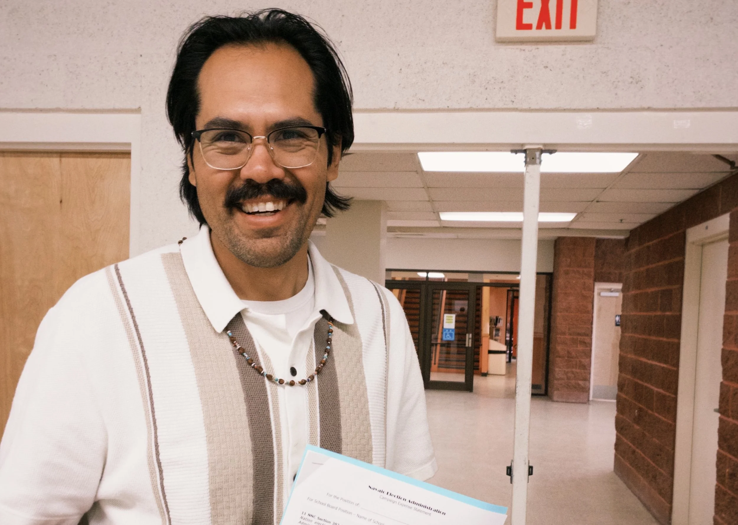 Andrew Curley smiles after officially submitting his name as a Navajo Nation Presidential Candidate