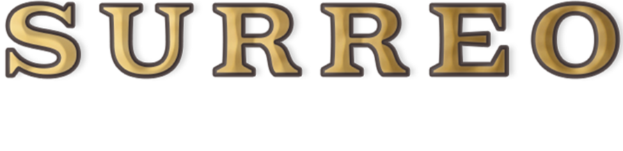 Close-up of the word 'SURRÉO' in large, gold and black stylized letters.
