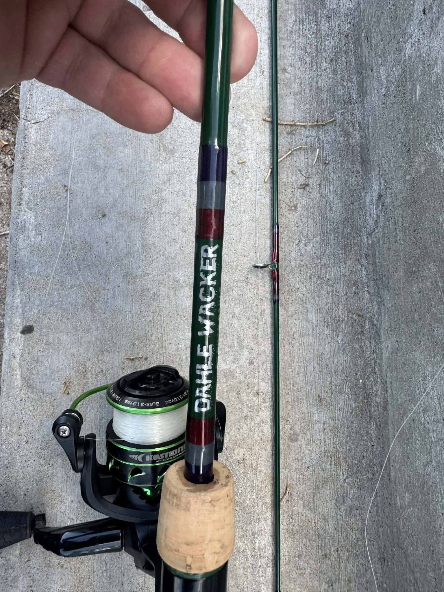 Custom fishing rod with decorative handcrafted wrap detail created by Dilly Dahle Custom Rods.