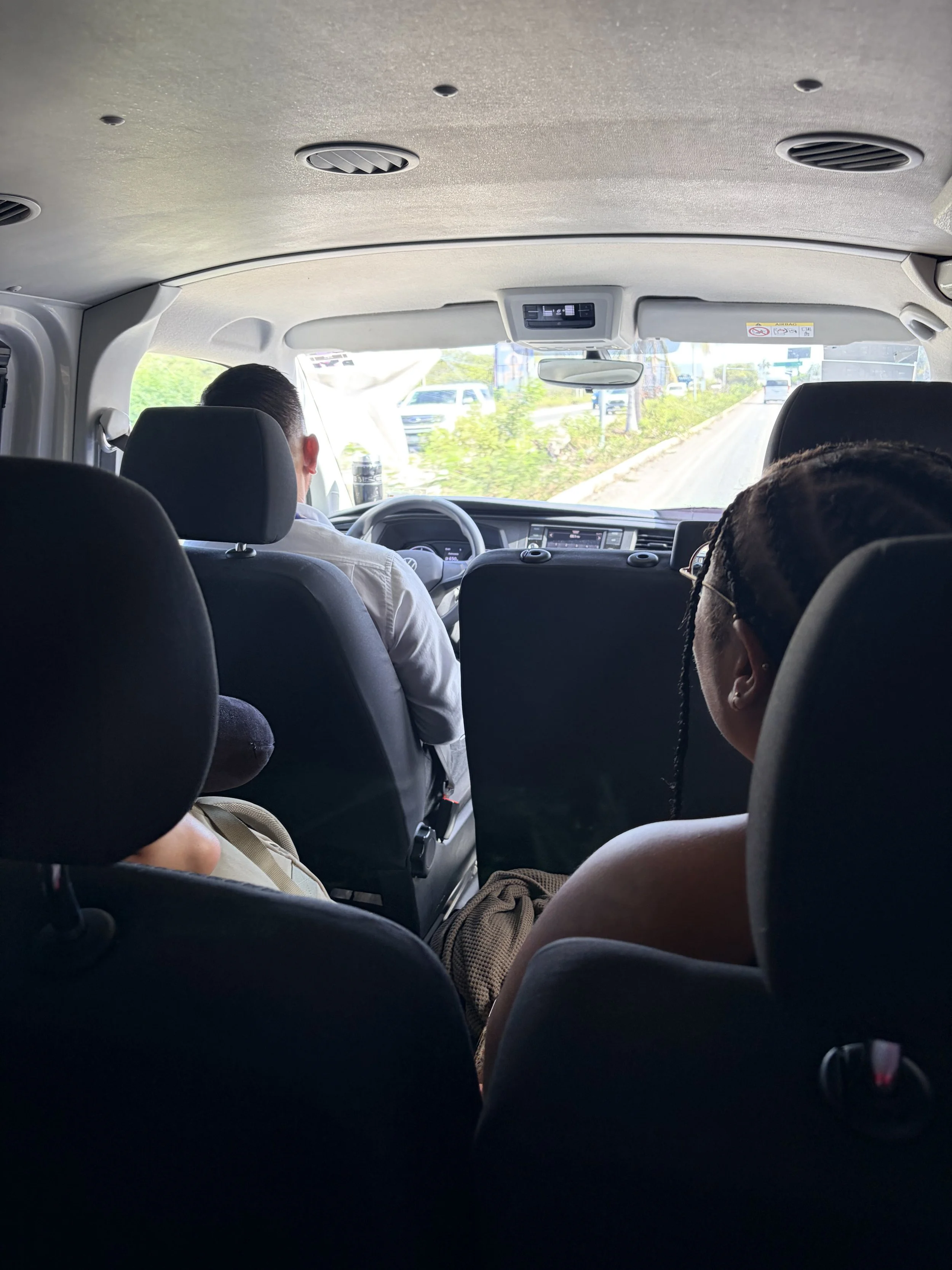 Nexus private transfer vehicle, two women sit in front