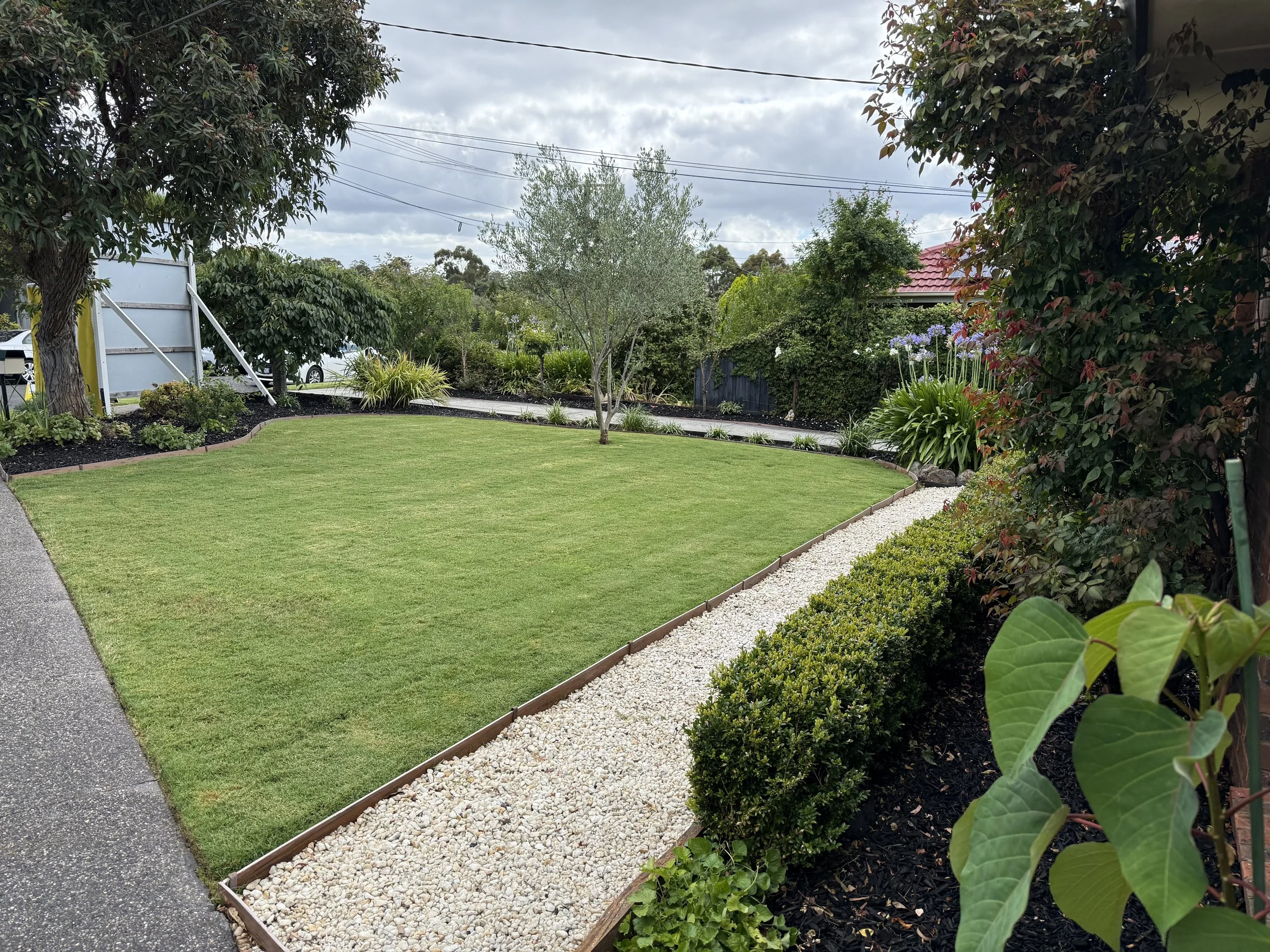 Manicured lawn and clean gravel path after a pre-auction garden clean-up in Vermont South"