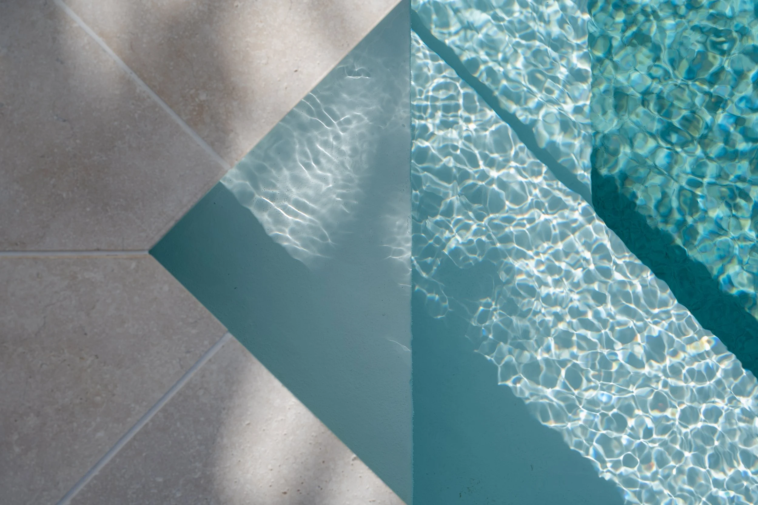 interior shoot for Airbnb home pool featuring travertine tiles.