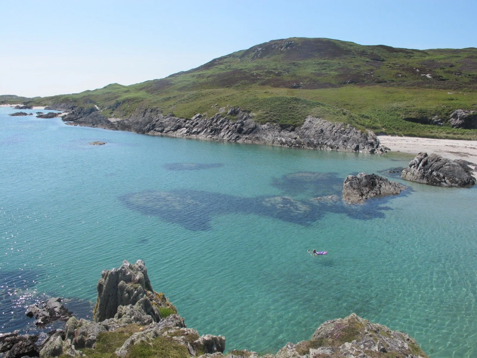 Swimming in the crystal clear waters of Cable Bay