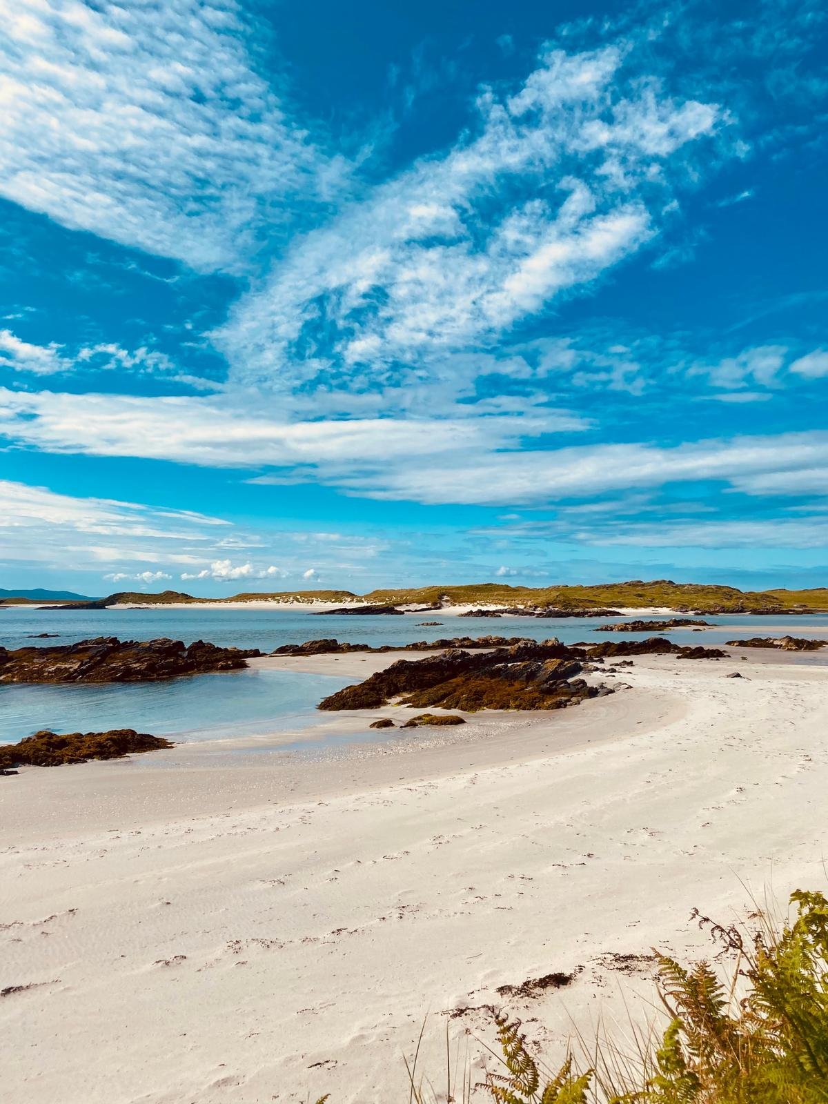 Scenic view of a sandy beach on the way to the Oronsay Priory