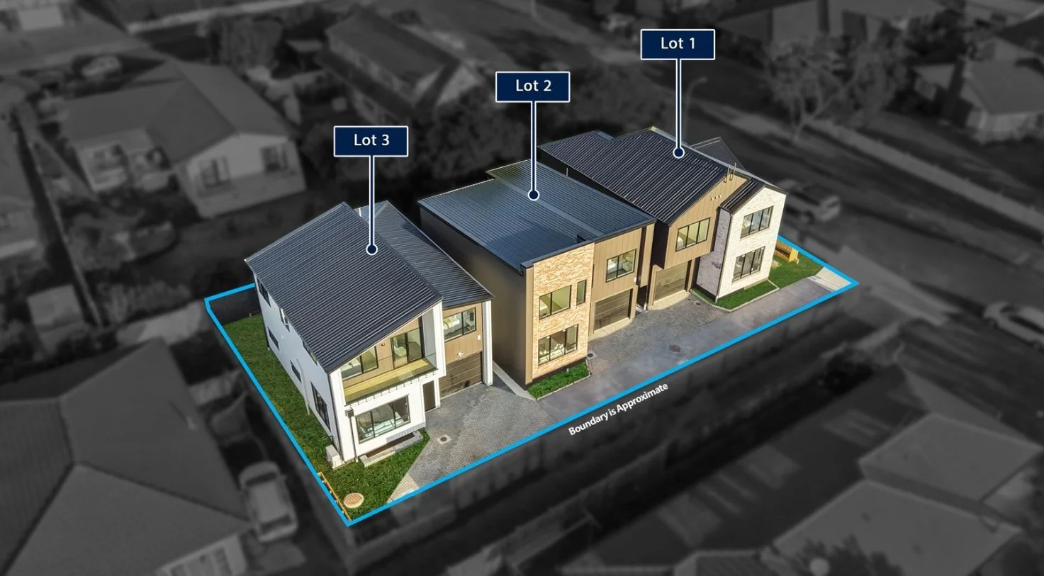 Aerial view of a modern townhouse complex with three separate units, each with a different exterior design, on a lot with a boundary marked in blue. Labeled sections named Lot 1, Lot 2, and Lot 3.