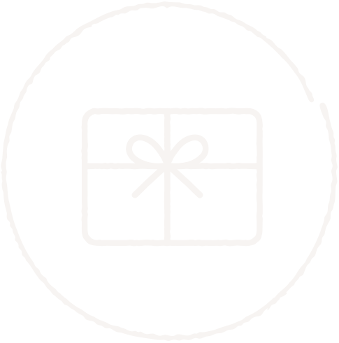 White gift box with a bow inside a circle on a black background.