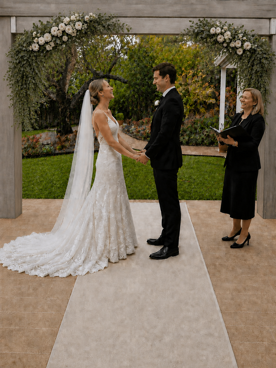 Couple holding hands during an intimate garden wedding ceremony at The Elopement House Templestowe.