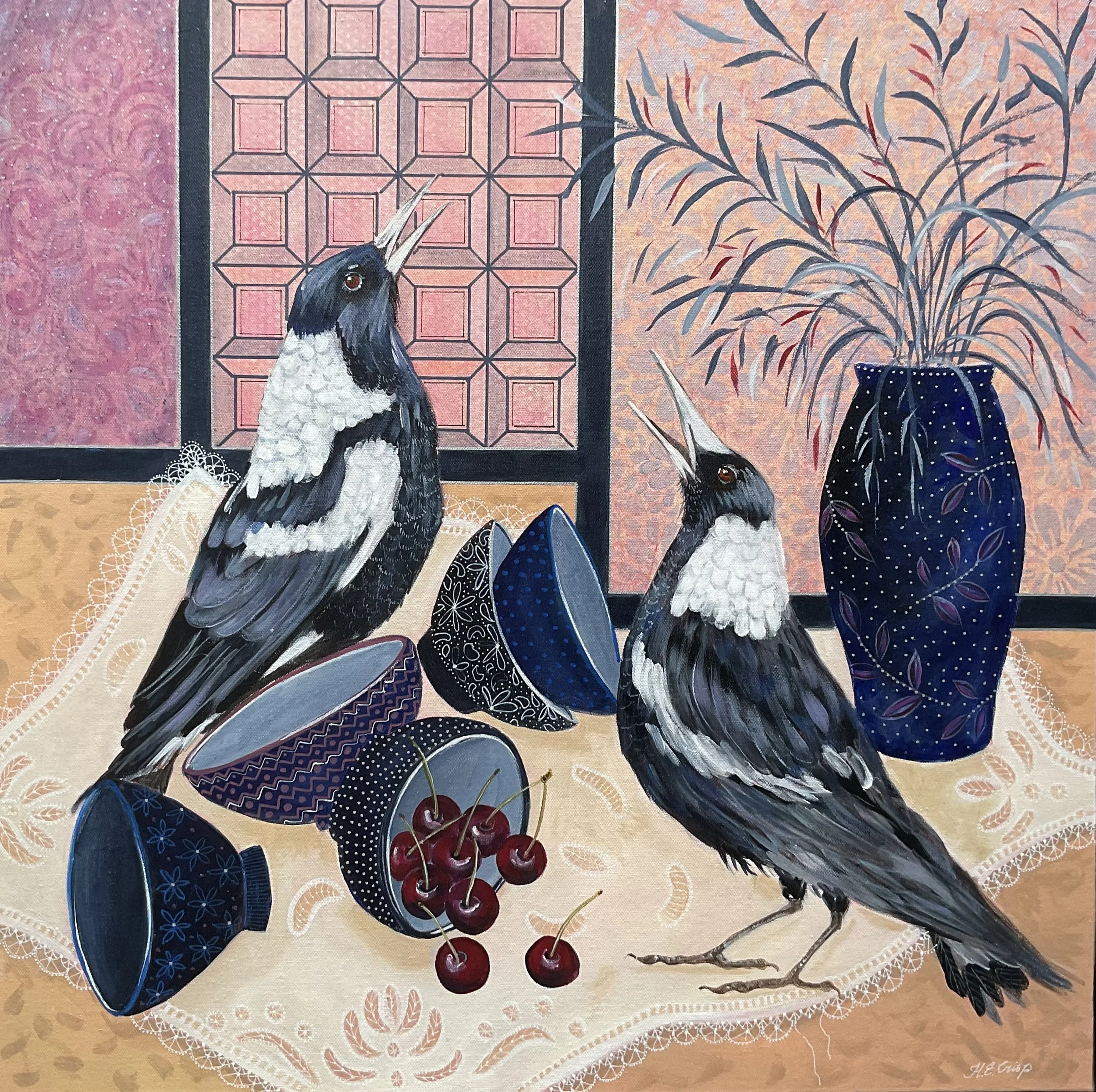 A painting of two magpies perched on a lace-trimmed tablecloth near a bowl of cherries and a vase with decorative branches. The background features patterned papers with geometric and floral designs.