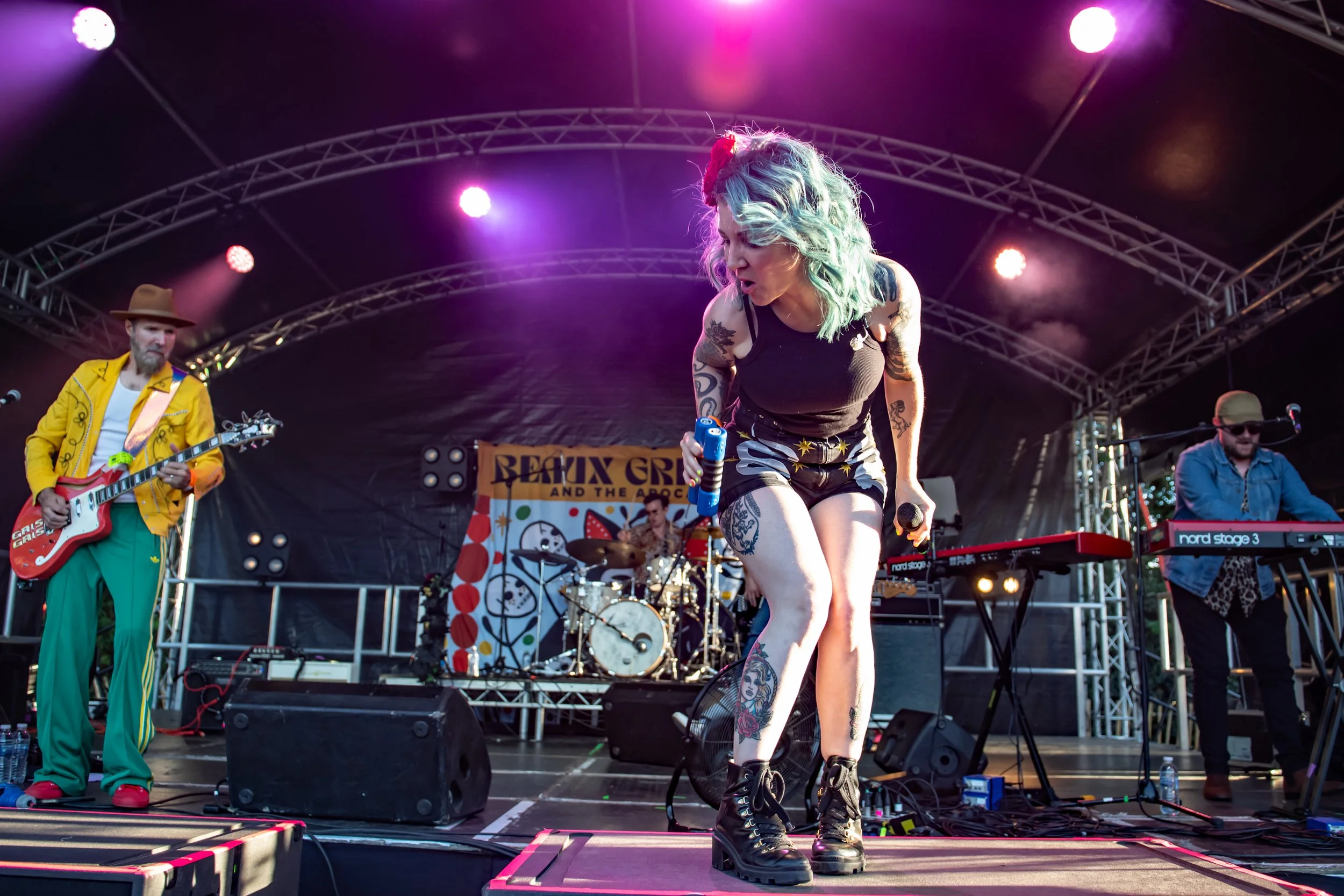 High-energy live performance by Beaux Gris Gris & The Apocalypse at Cornbury Festival. Wide-angle concert photography featuring the lead singer and full band by Two Finger Media.