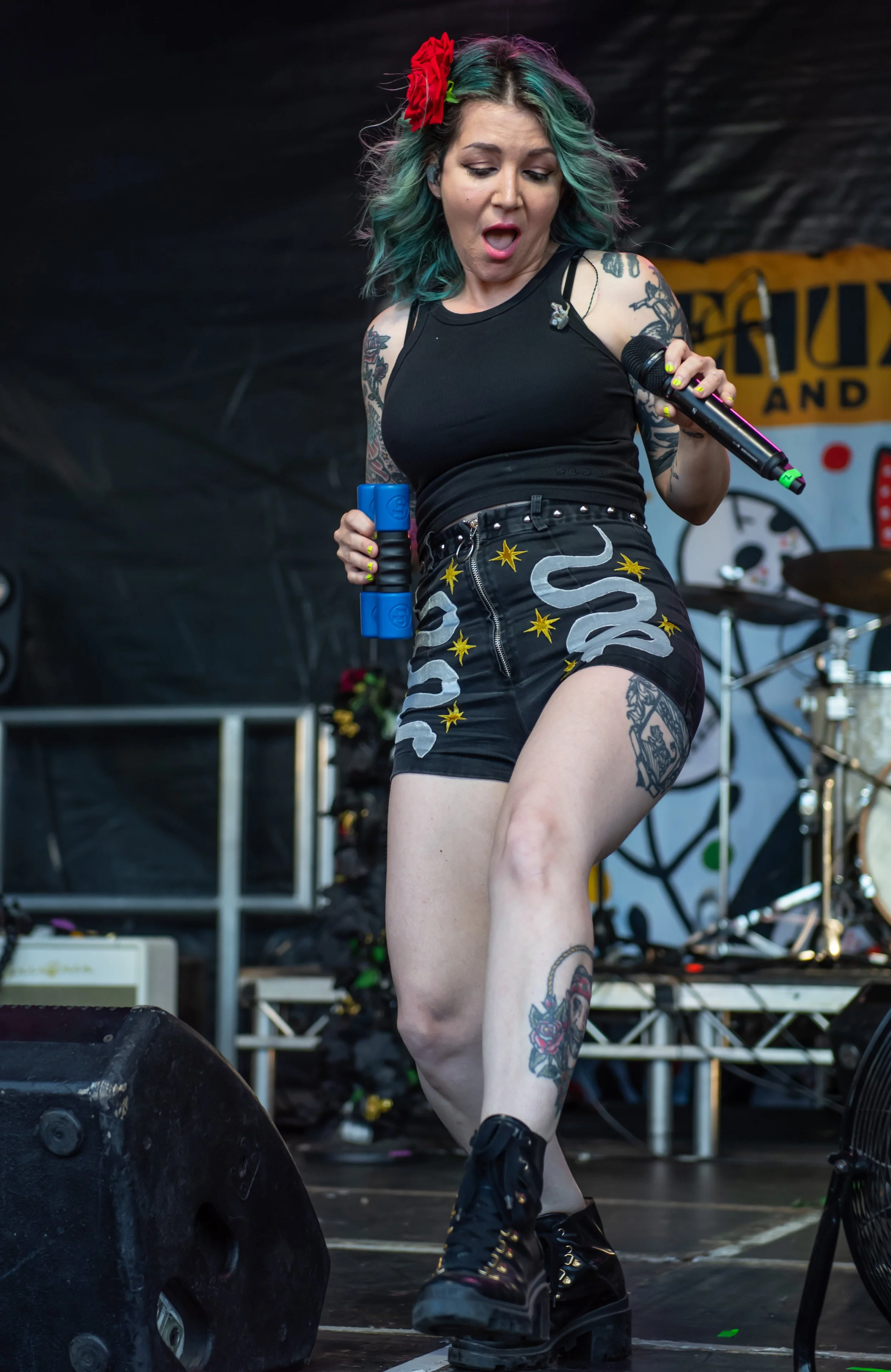 Close-up portrait of the lead singer of Beaux Gris Gris & The Apocalypse during a live rock performance at Cornbury Festival. Professional live music photography by Two Finger Media.