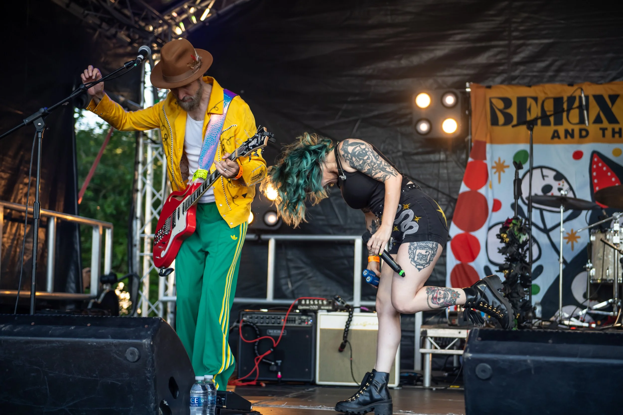 Live concert photograph capturing the guitarist and lead singer of Beaux Gris Gris & The Apocalypse performing on stage at Cornbury Festival. Professional festival photography by Two Finger Media.