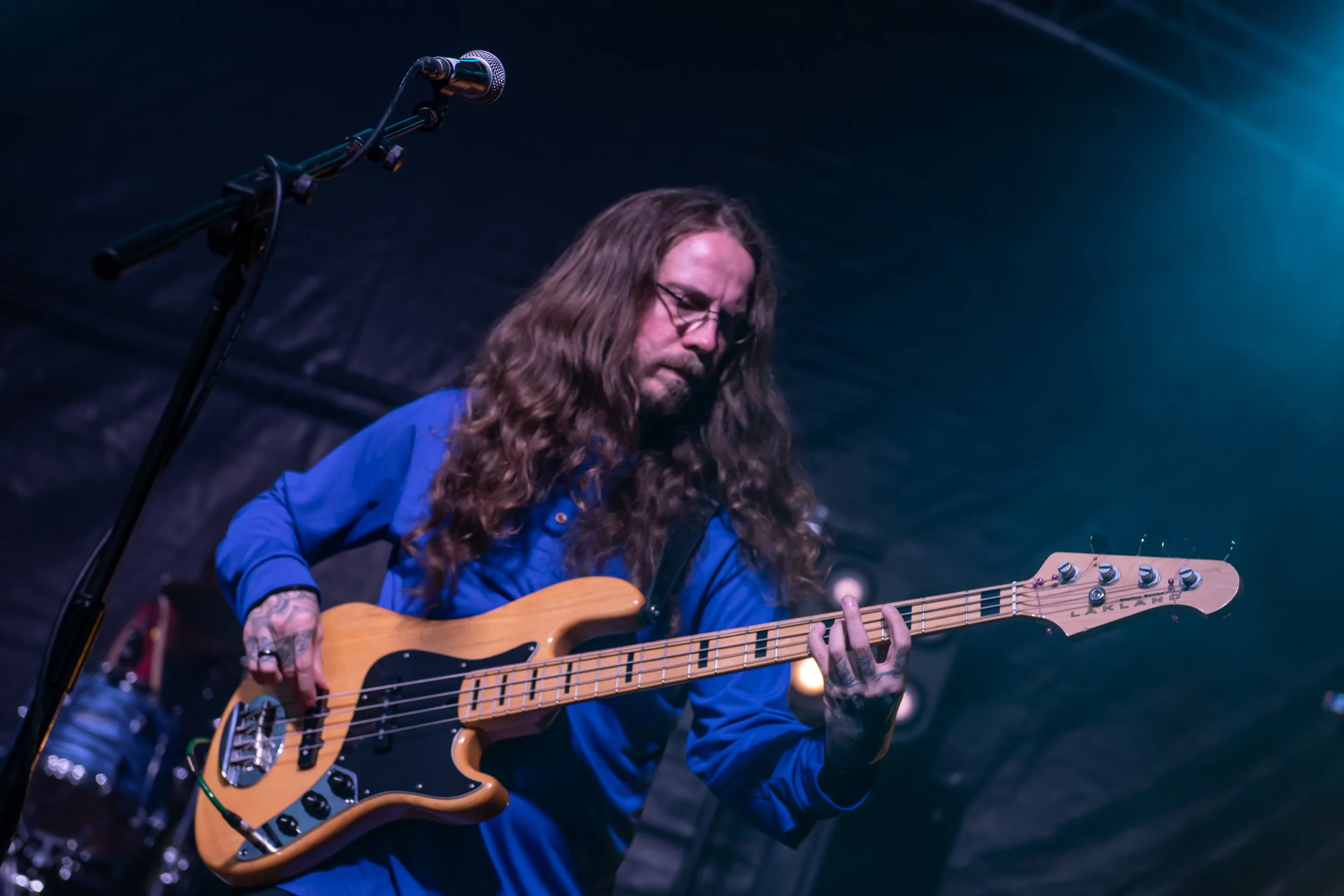 Bass guitarist performing live at Loverocks IX, 18 June 2026. Concert photography by Two Finger Media.