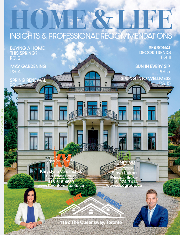 Cover of 'Home & Life' magazine featuring a large, luxurious white house with black accents on a well-manicured lawn, with real estate agents' photos and contact information at the bottom.