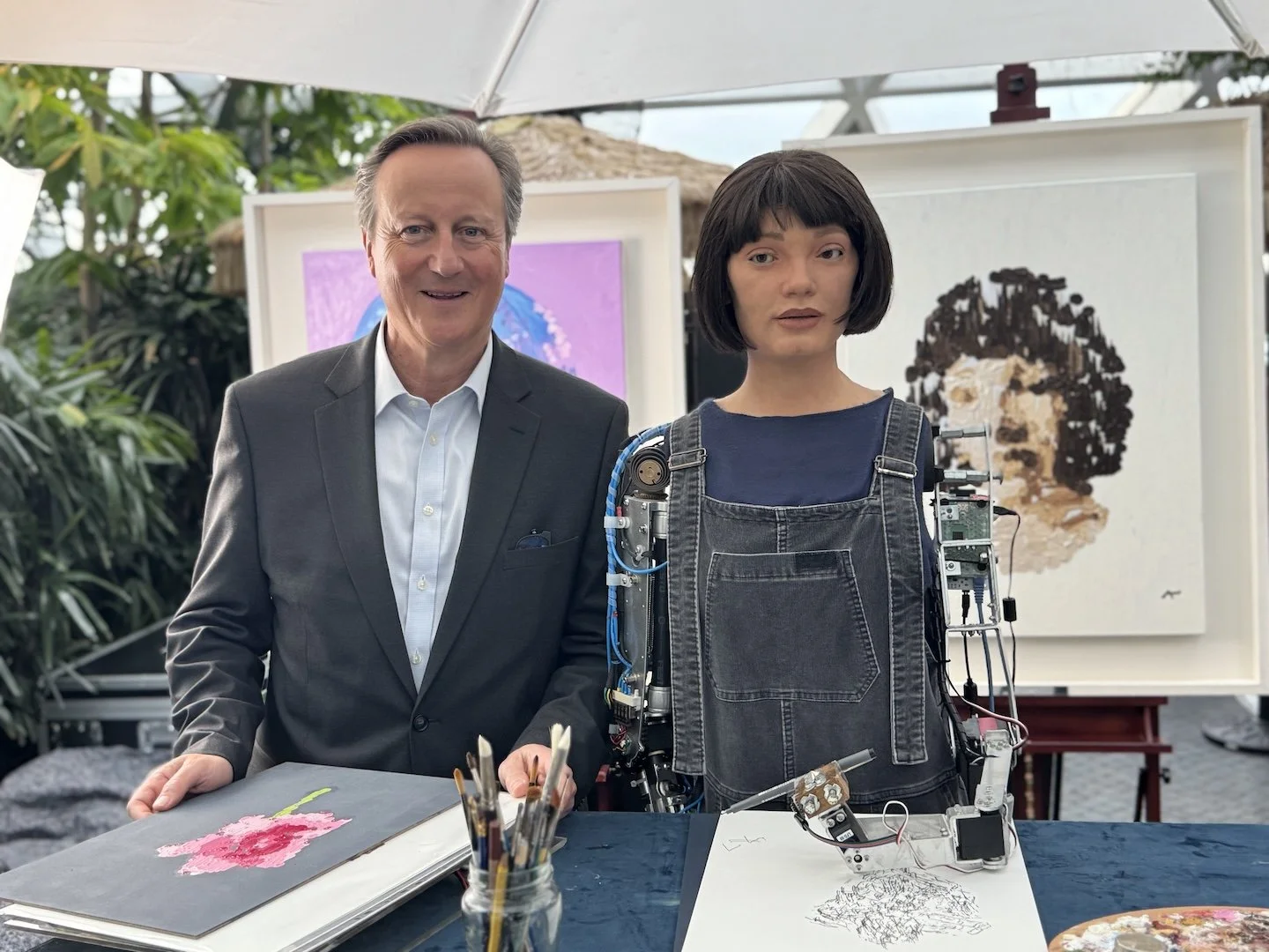 Ai-Da with former UK Prime Minister Lord David Cameron