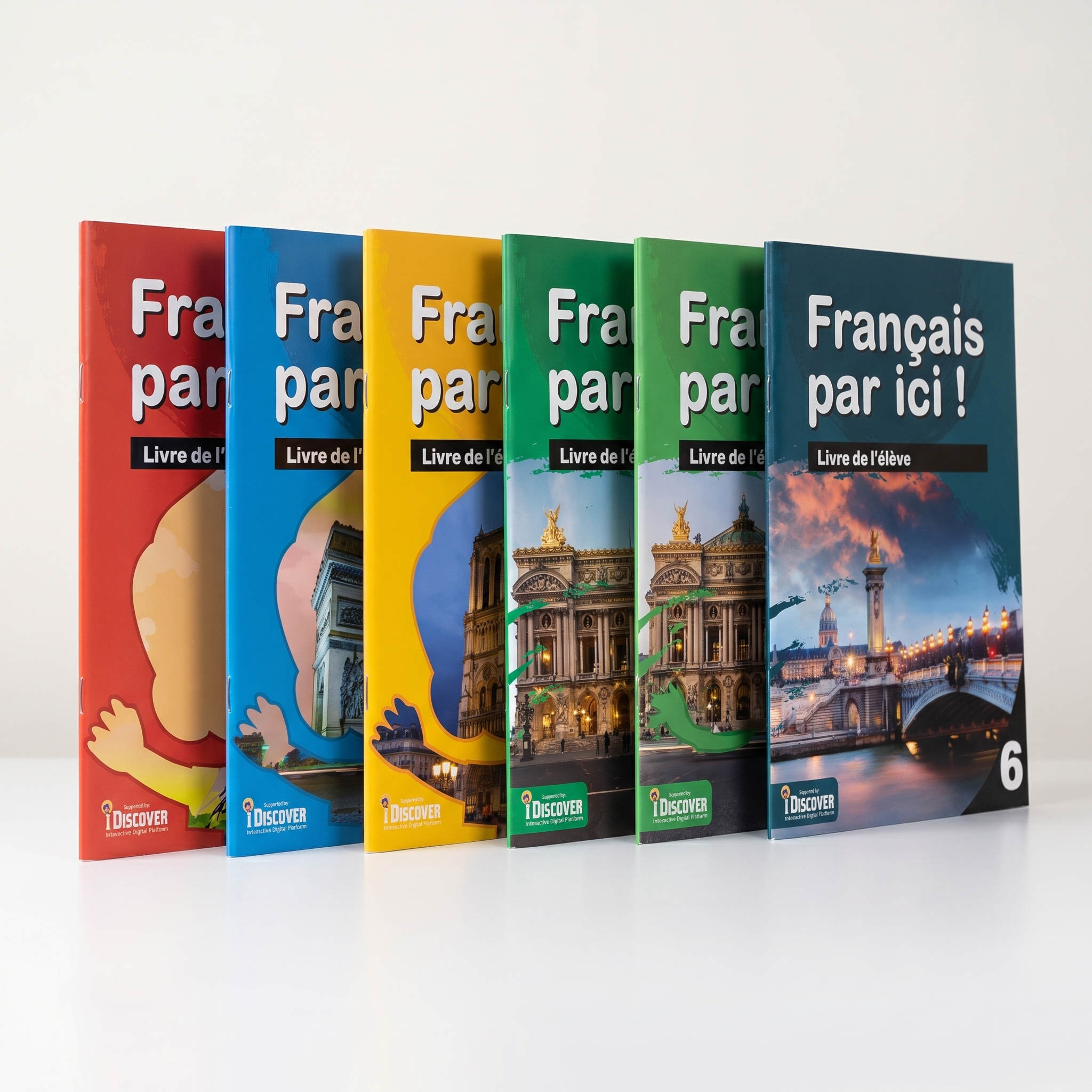 Six colorful booklets in red, blue, yellow, green, dark green, and dark blue standing upright on a white surface, each with images of iconic Paris landmarks like the Eiffel Tower and Arc de Triomphe, and the text 'Français par ici!' on the covers.