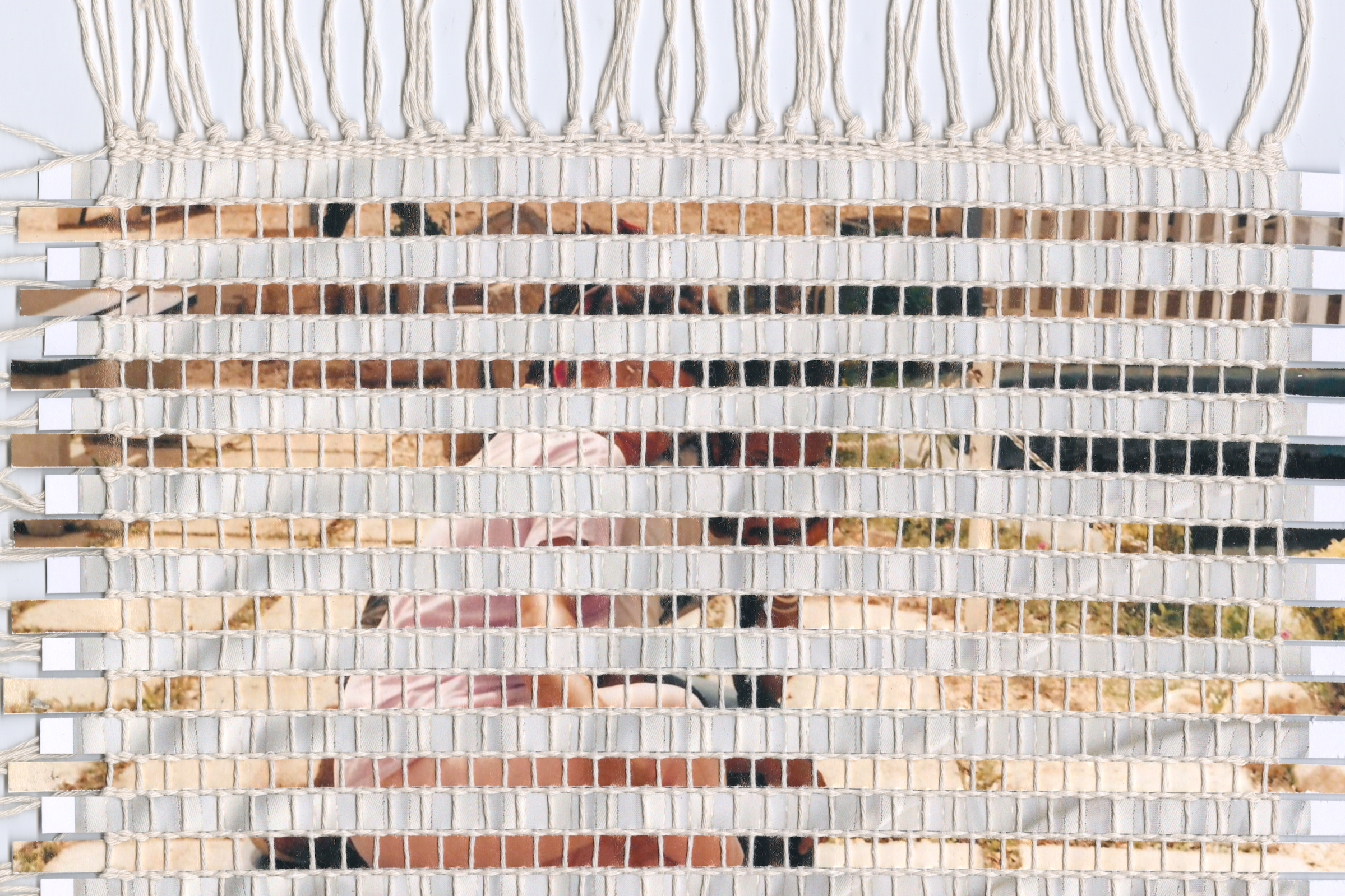 Mixed media weaving created using strips of family photographs.