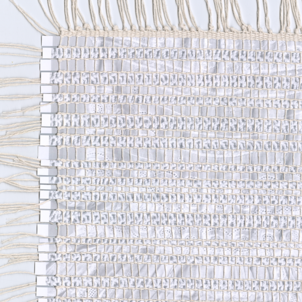 Mixed media weaving created using strips of scanned fabric.