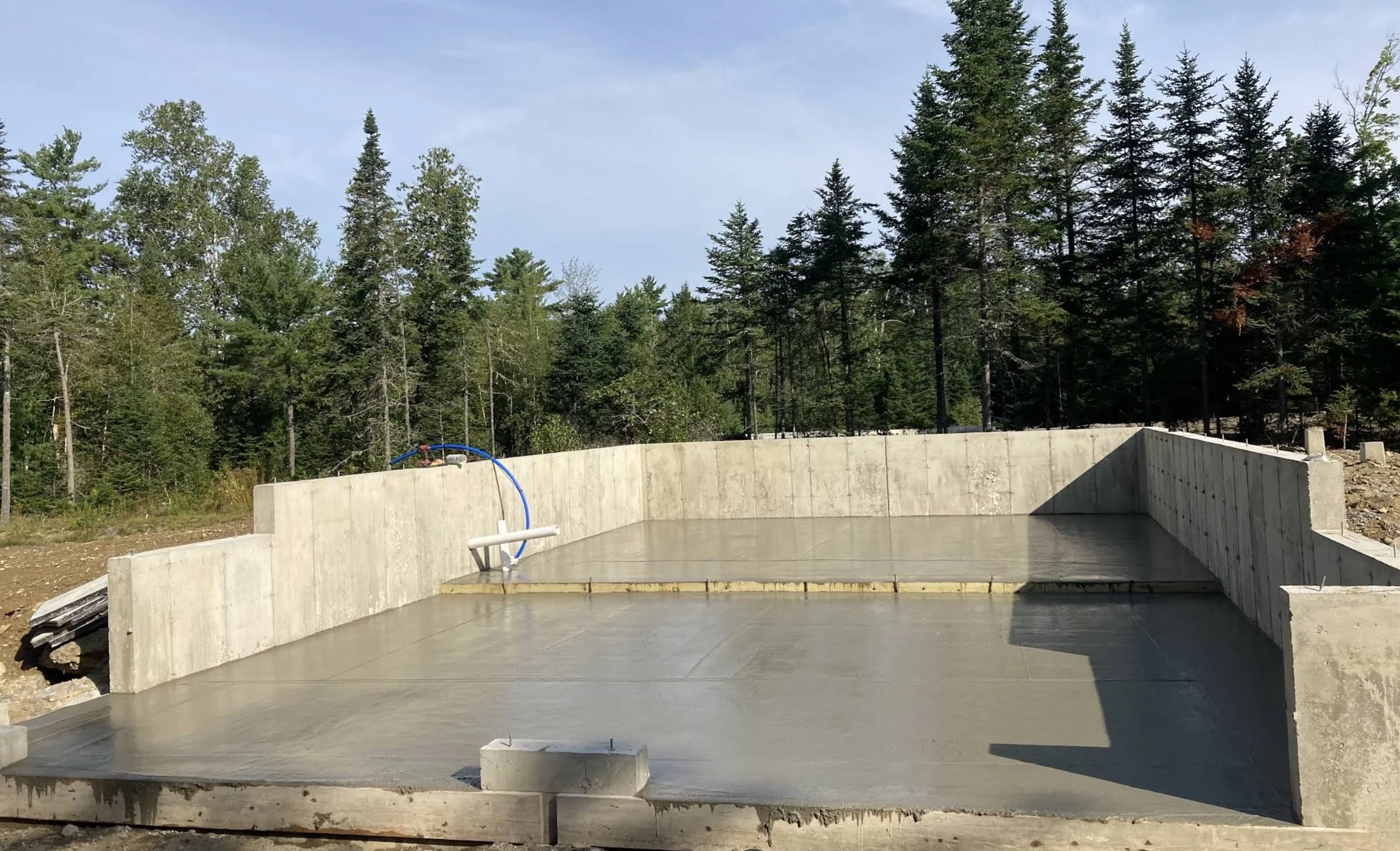 Concrete foundation and walls for new construction.