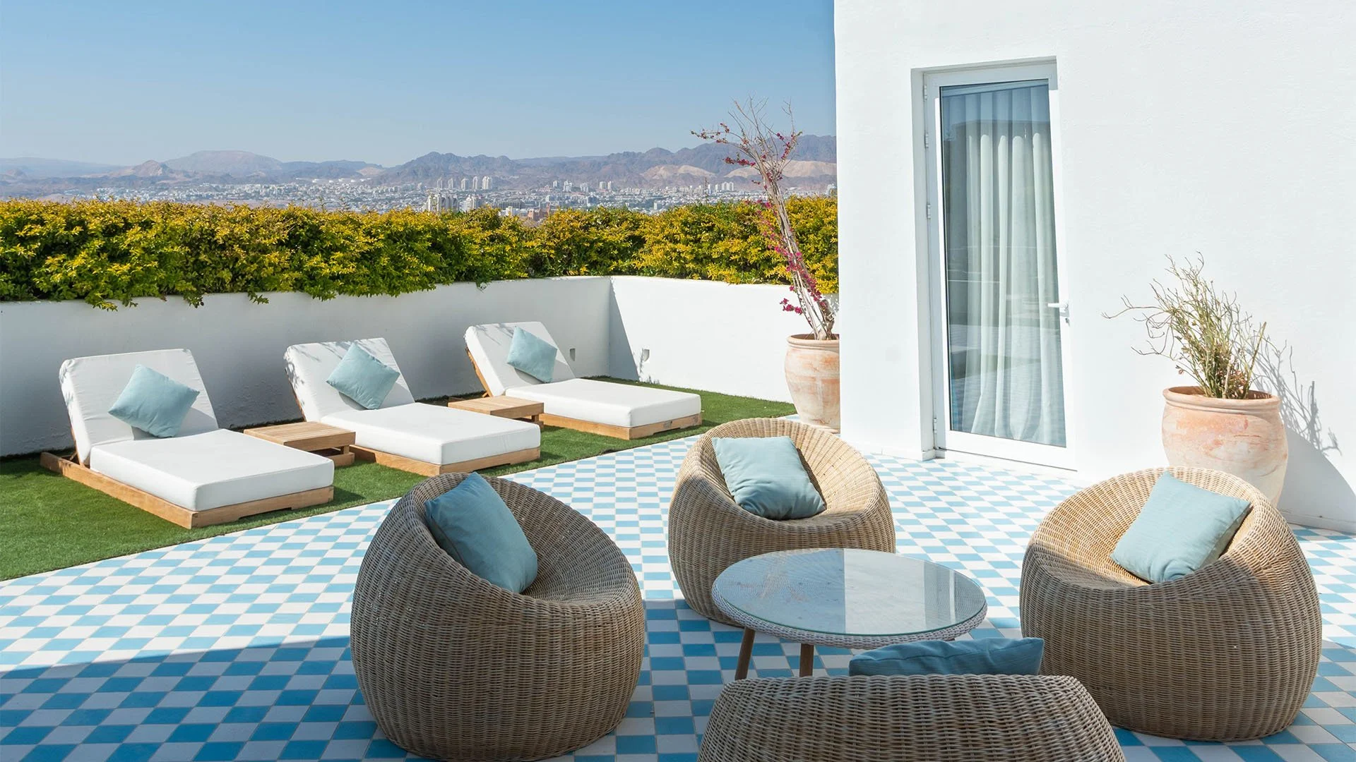 RoyalGem-Cloud7-Aqaba-Residence-Luxury-Travel-Vacation-Aqaba-Jordan-Fourbedrooms-outdoor-sunbeds-outdoorarea.jpg