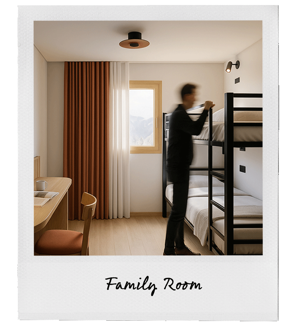 A person making a bed in a family room with a bunk bed, window, and a desk area with a chair.