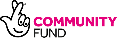 Logo of a community fund featuring a hand making a peace sign with a smiling face, and the words 'Community Fund' beside it.