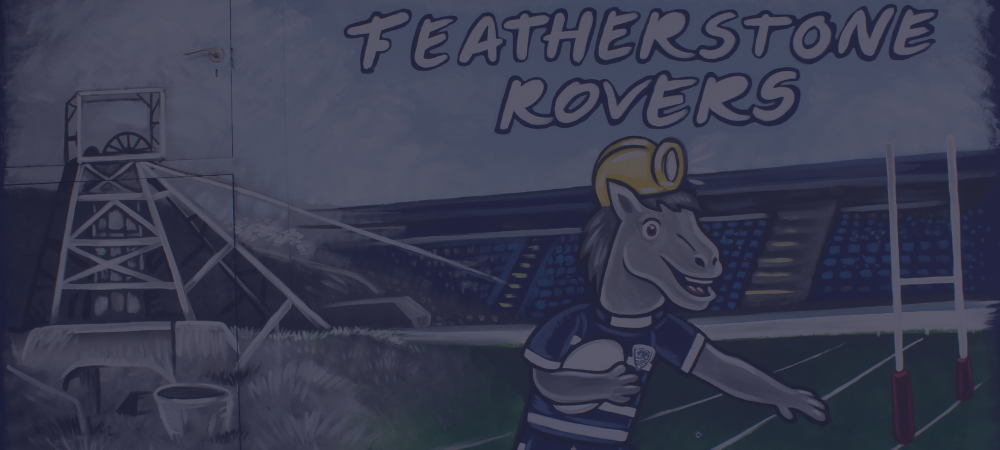 A mural of a horse wearing a rugby helmet and a rugby shirt, with a rugby stadium and scoreboard in the background, representing the Featherstone Rovers rugby team.
