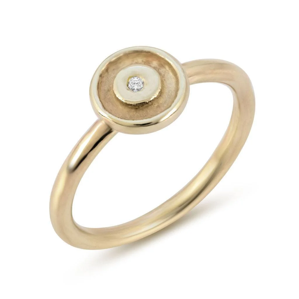 A gold ring with a small diamond in the center.