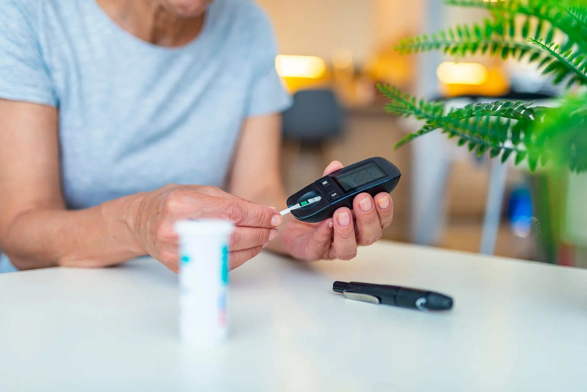 woman checking blood sugar levels reading diabetes management