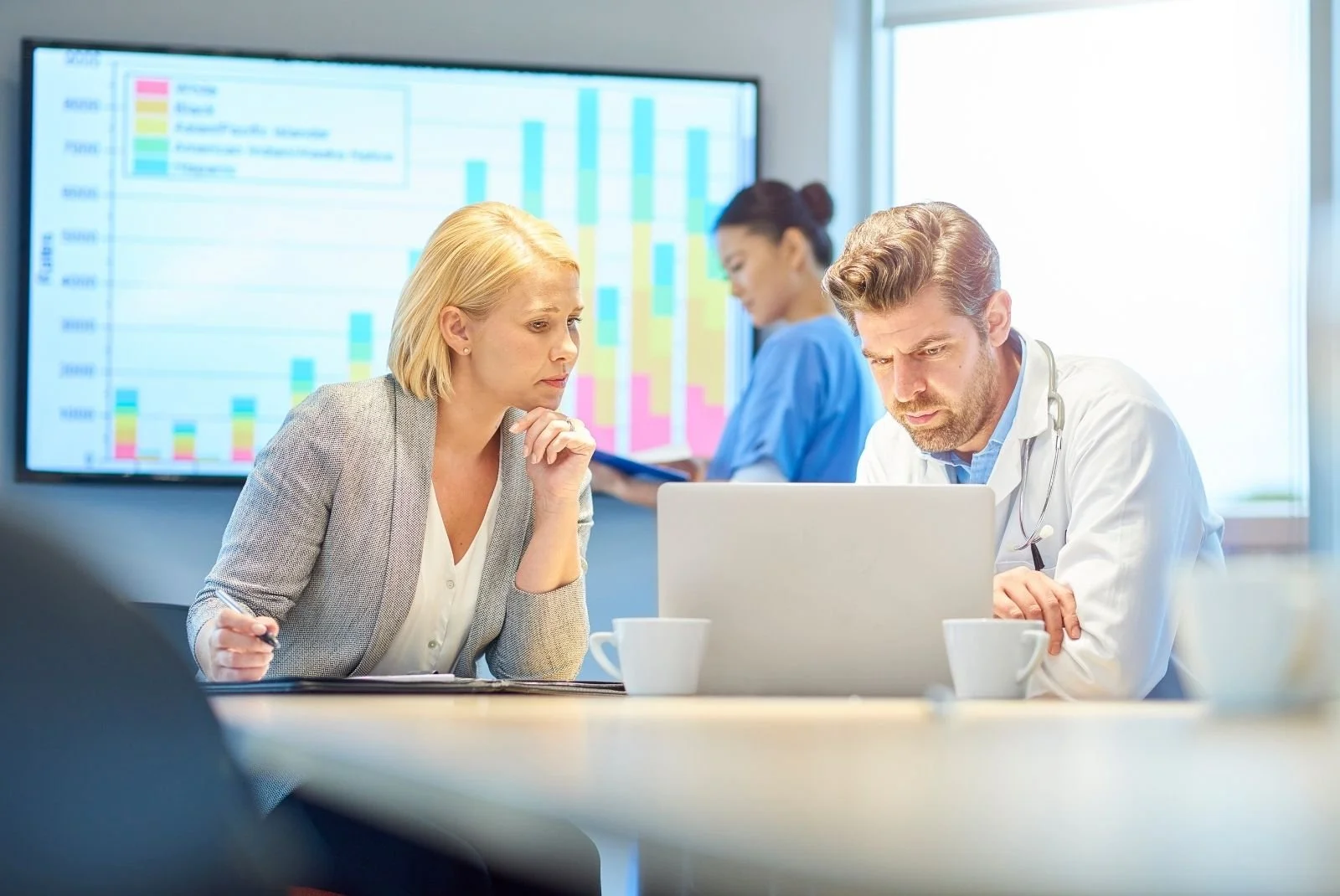 Doctors looking over patient test results