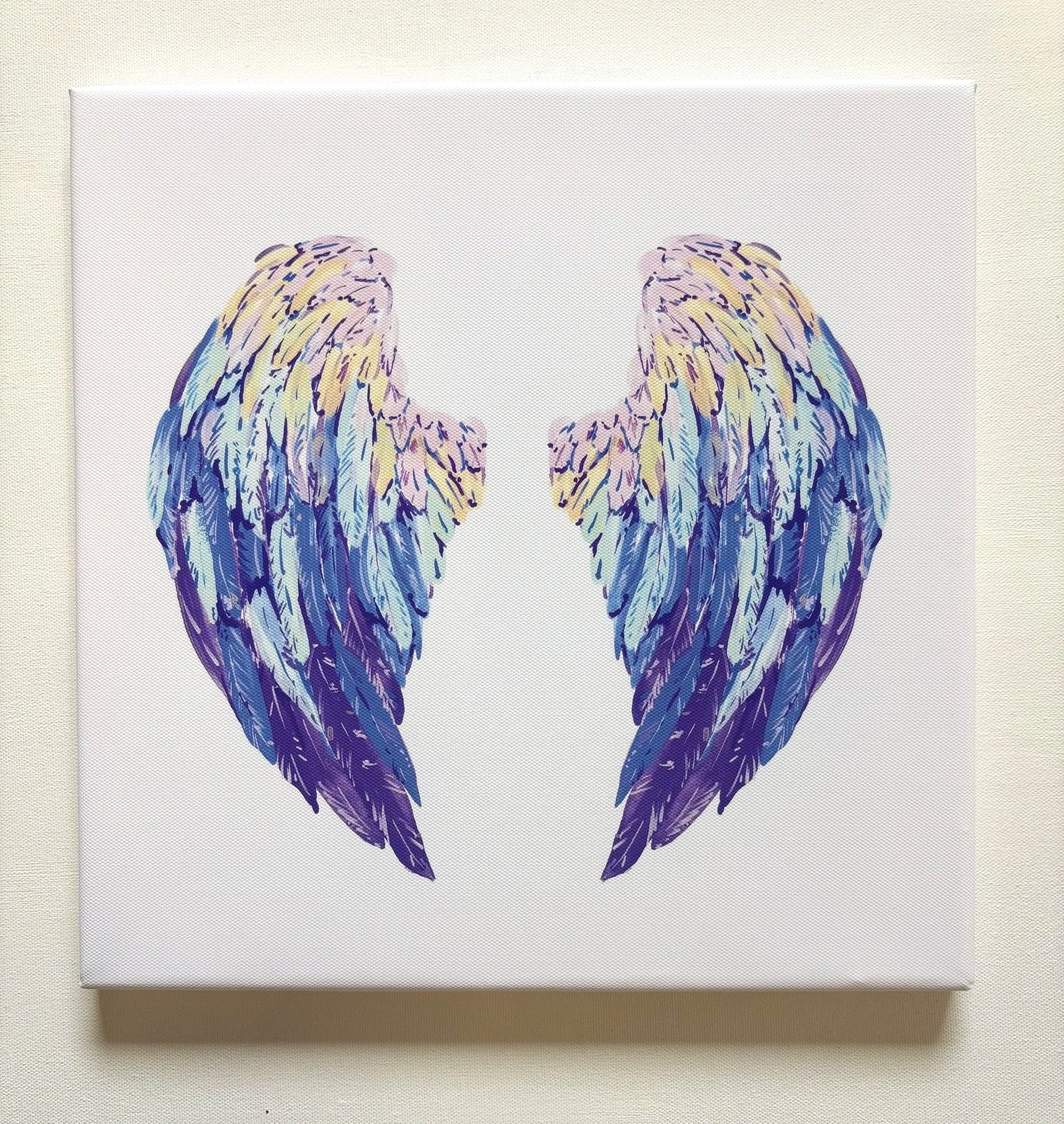 A painting of multicolored angel wings with shades of blue, purple, beige, and pink on a white canvas.
