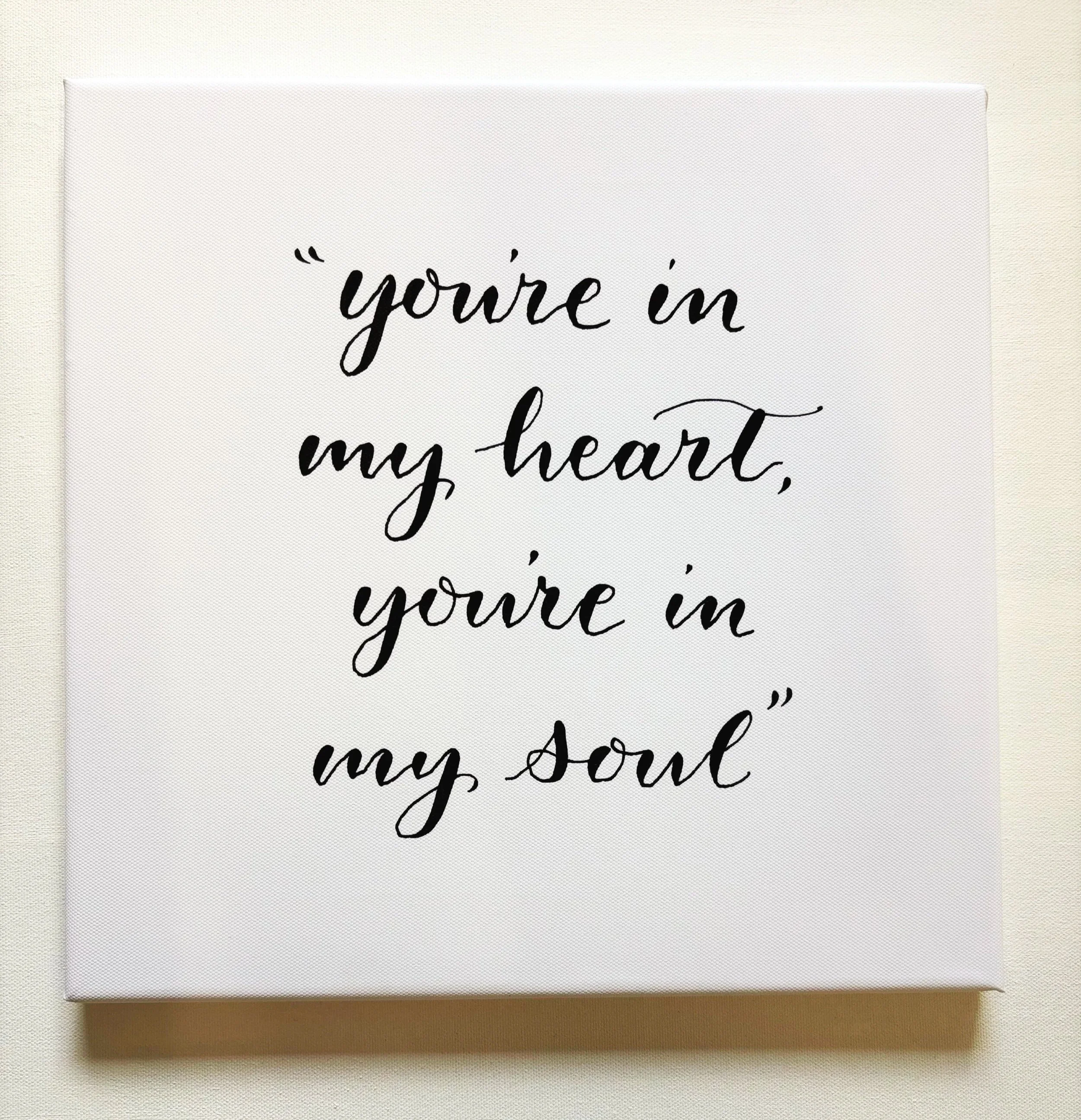 A white canvas with black cursive text that says, "you're in my heart,"