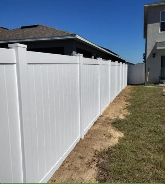 White vinyl privacy fence installed in an Orlando, FL backyard
