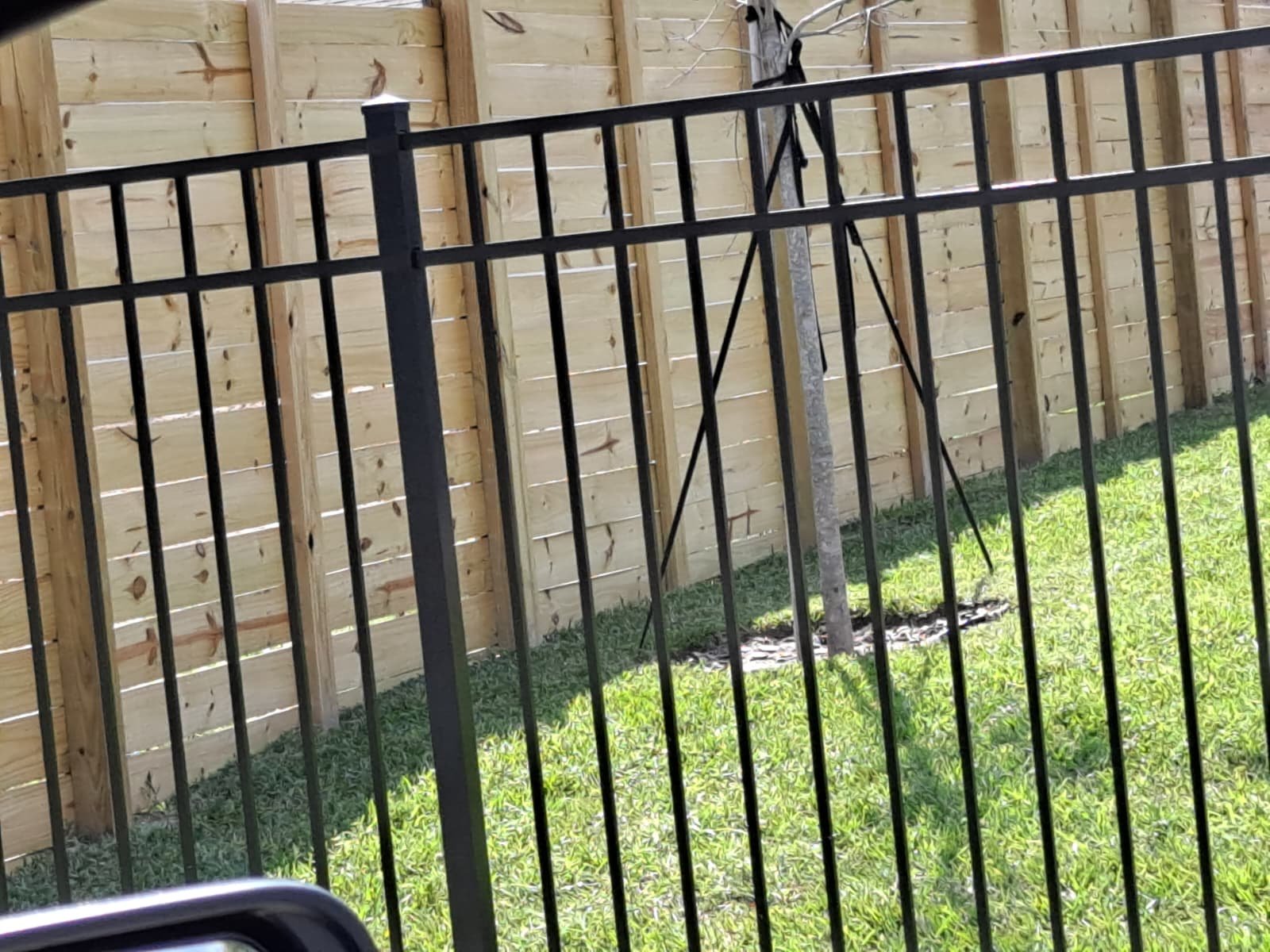 Black aluminum fence installed at Central Florida residential property